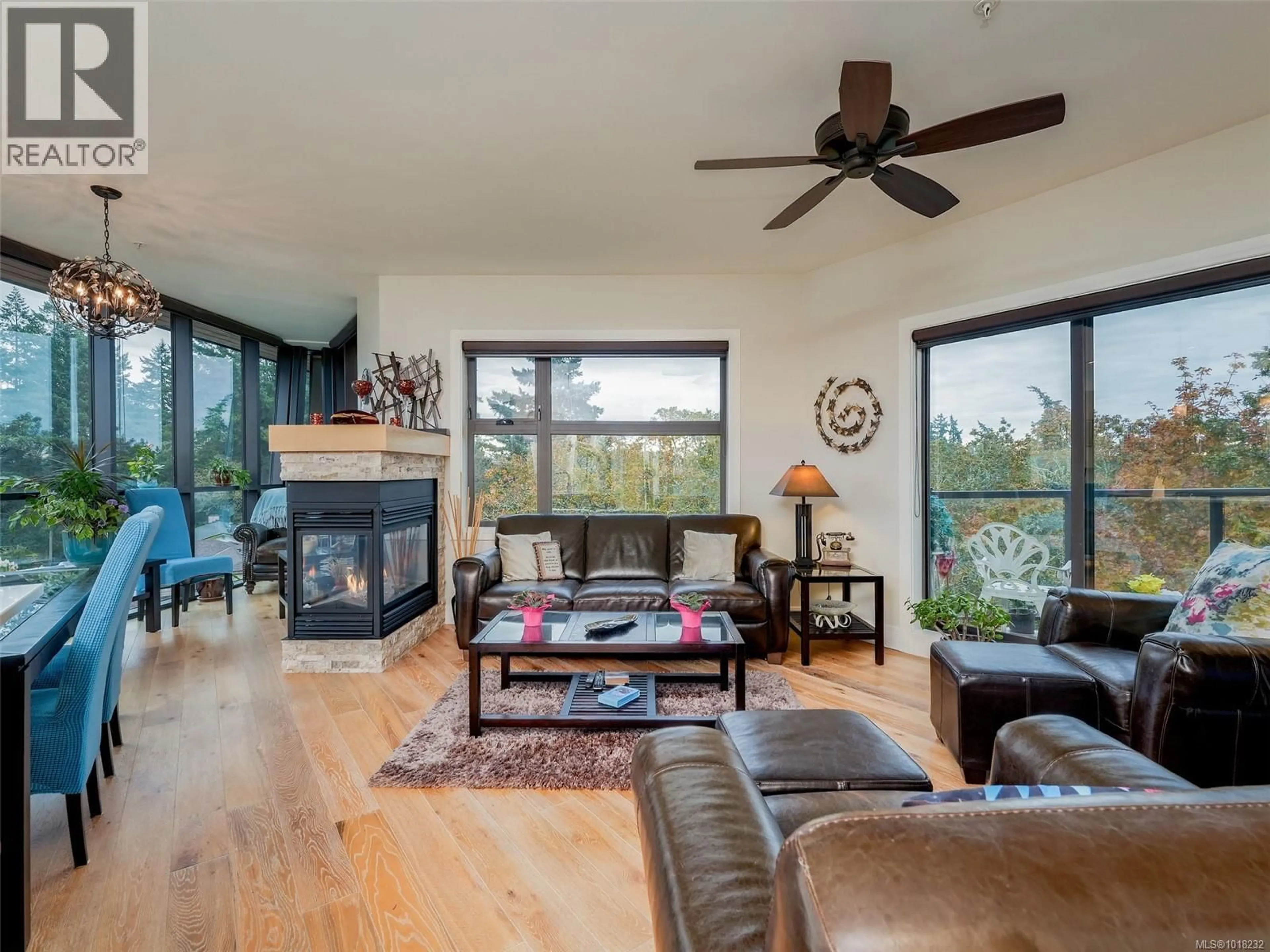 Living room with furniture, wood/laminate floor for 401 - 2850 ALDWYND ROAD, Langford British Columbia V9B3S7