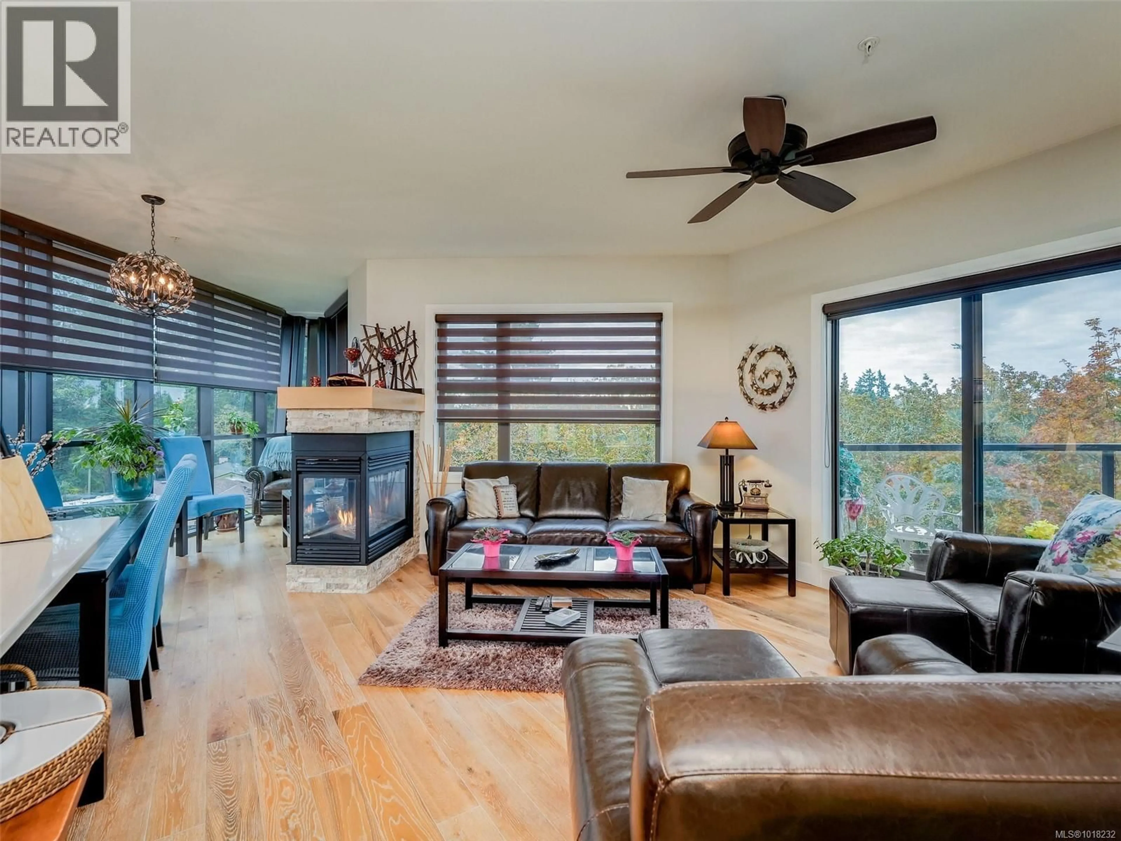 Living room with furniture, wood/laminate floor for 401 - 2850 ALDWYND ROAD, Langford British Columbia V9B3S7