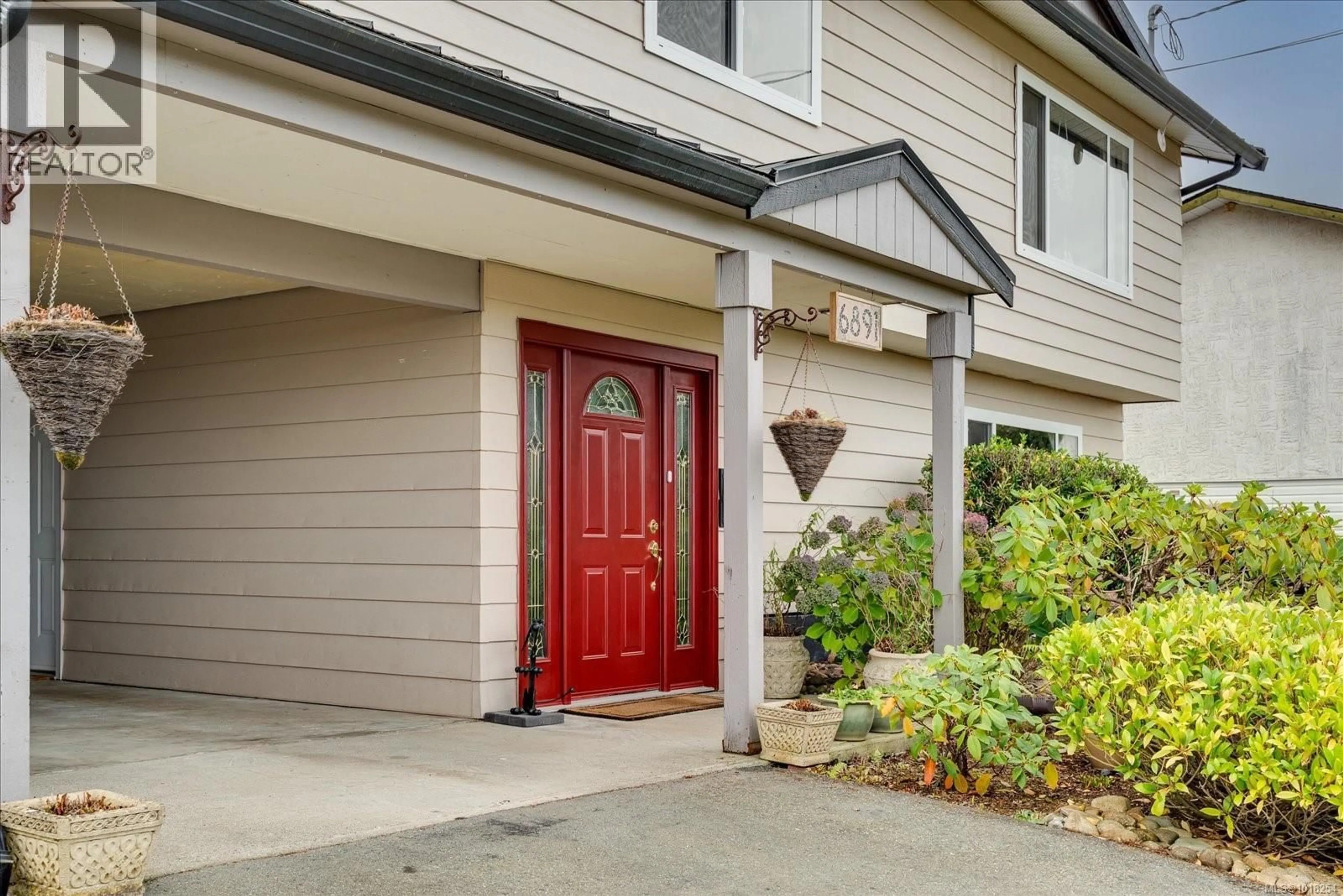 Home with vinyl exterior material, street for 6891 HARWOOD DRIVE, Lantzville British Columbia V0R2H0