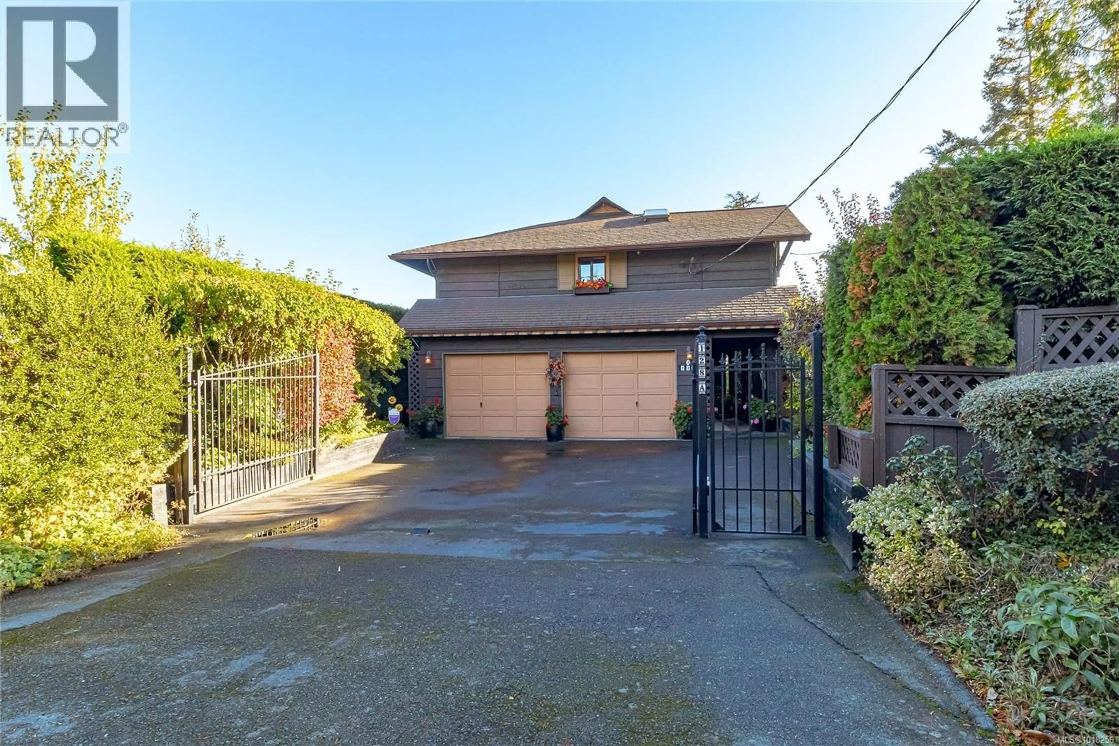A pic from outside/outdoor area/front of a property/back of a property/a pic from drone, street for A - 128 ST. GILES STREET, View Royal British Columbia V8Z5E5