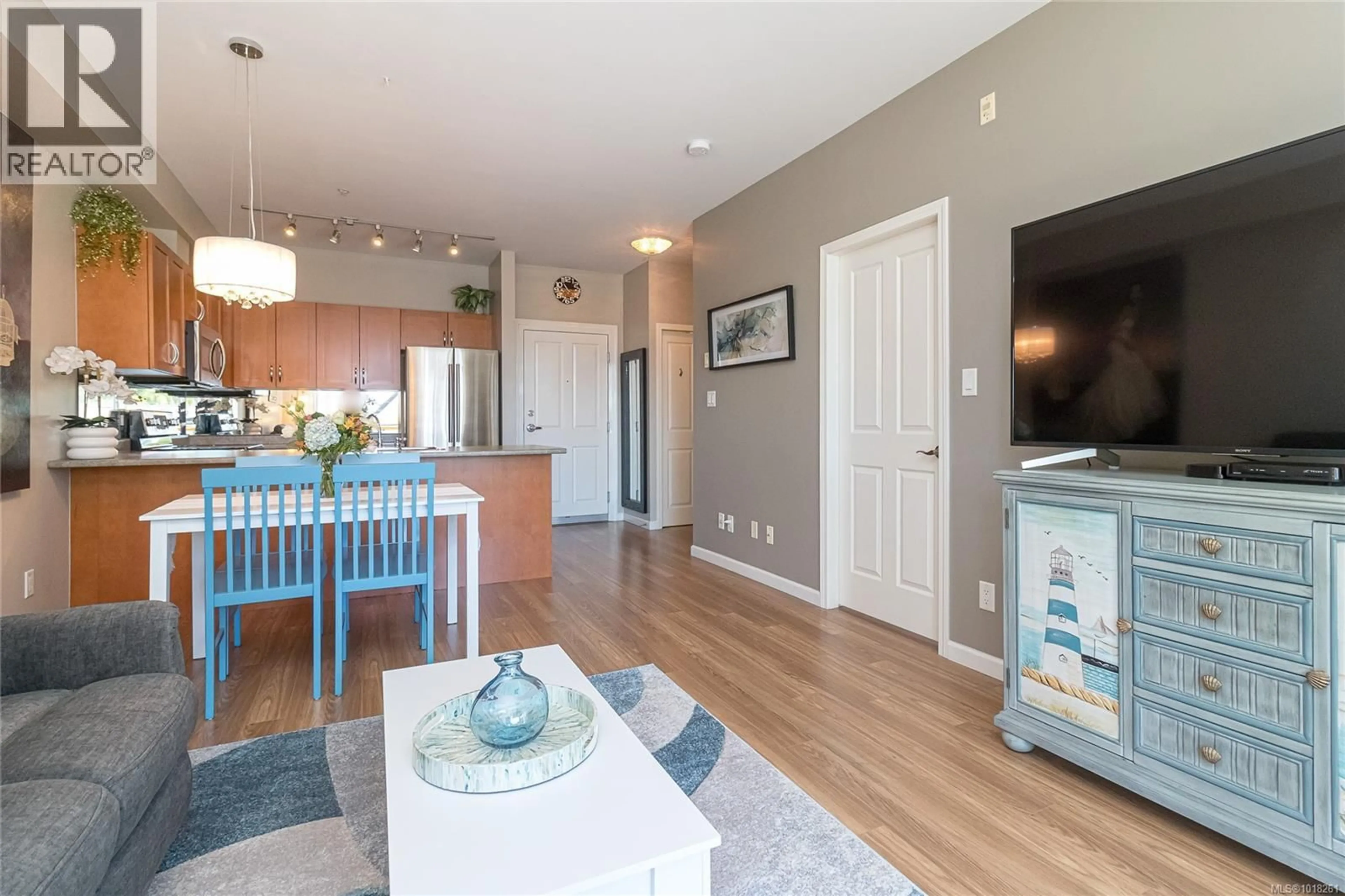 Open concept kitchen, wood/laminate floor for 210 - 1959 POLO PARK COURT, Central Saanich British Columbia V8M2K1