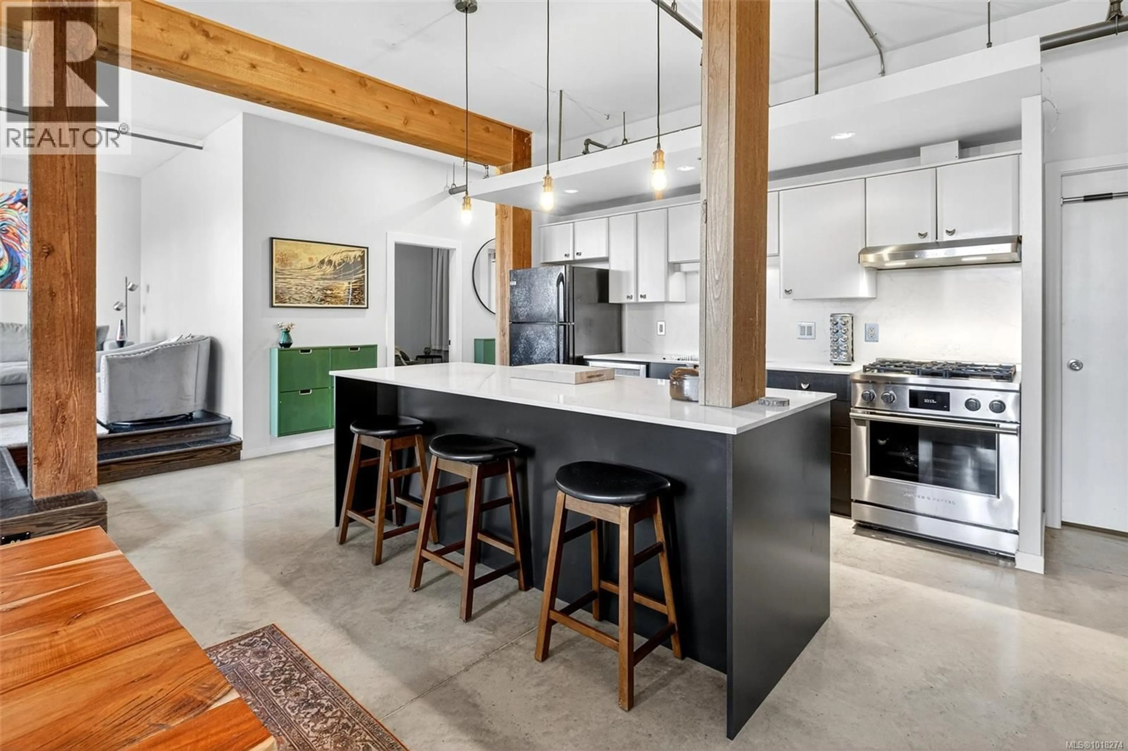 Open concept kitchen, cement floor for 211 - 455 SITKUM ROAD, Victoria British Columbia V9A7N9