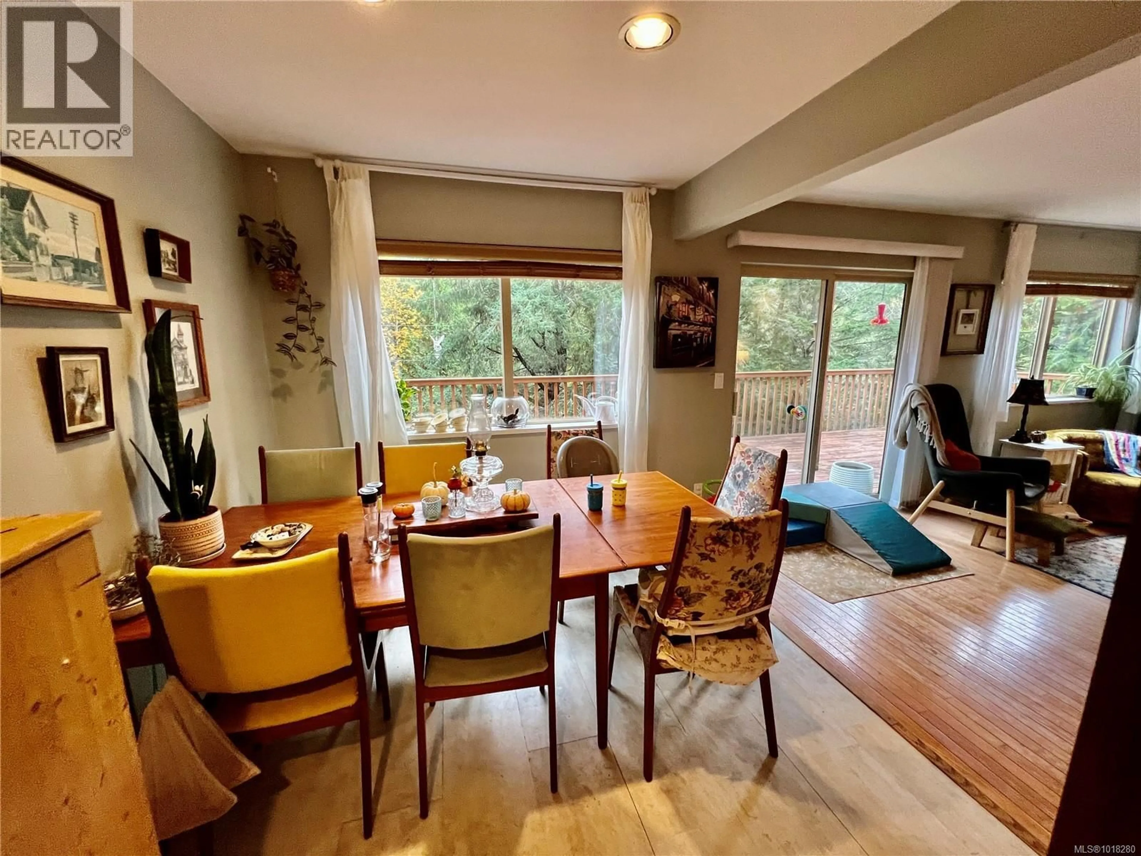 Dining room, wood/laminate floor for 702 CHARTER ROAD, Mayne Island British Columbia V0N2J1