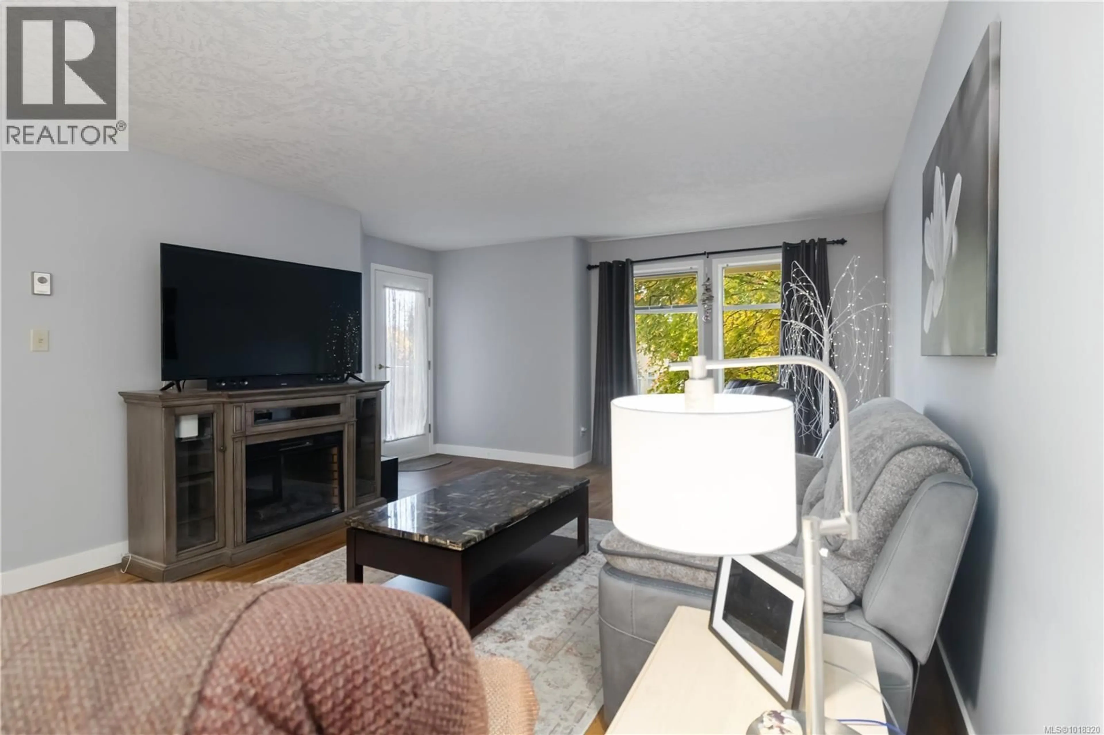 Living room with furniture, unknown for 201 - 2311 MILLS ROAD, Sidney British Columbia V8L2C3