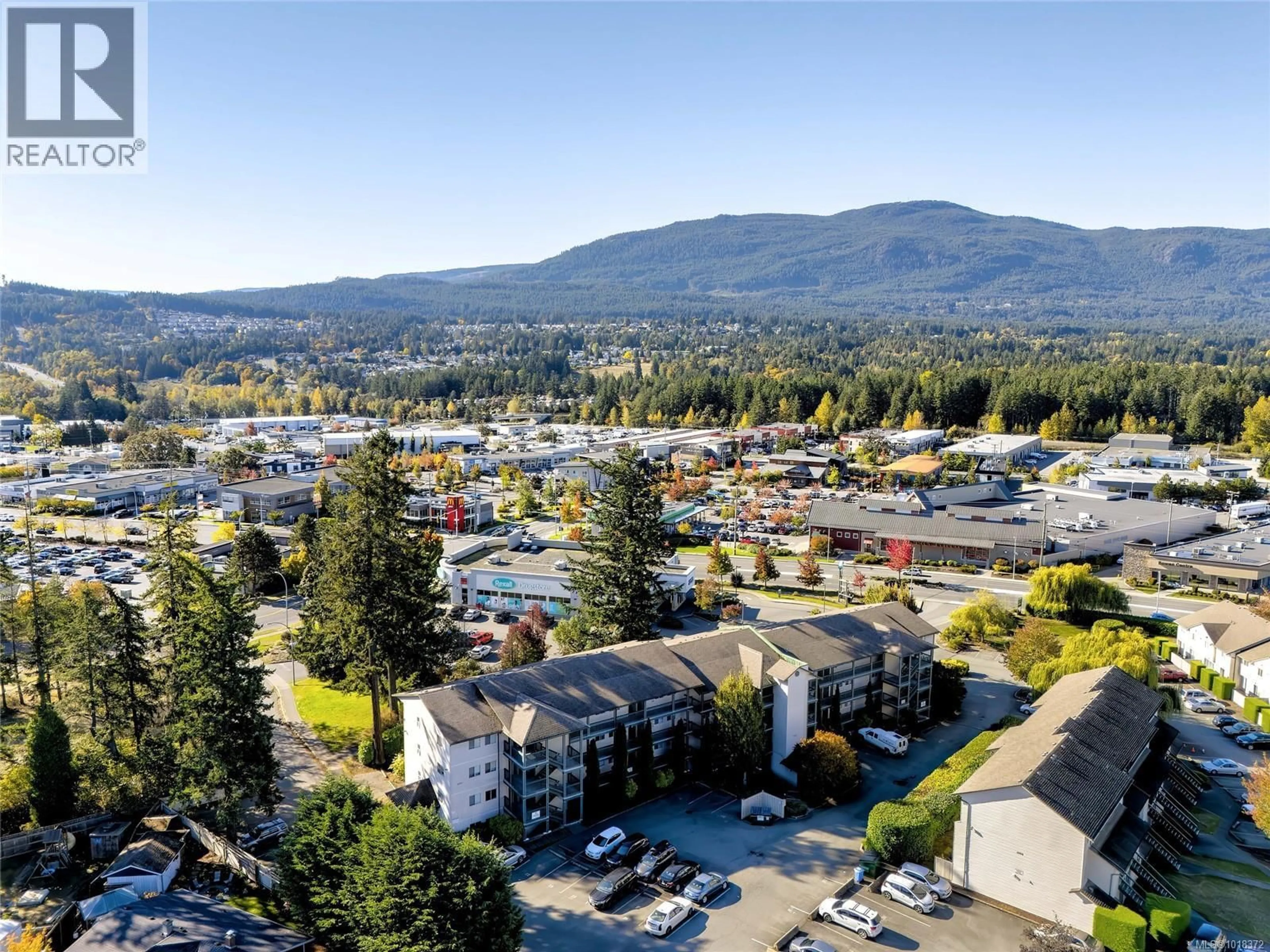 A pic from outside/outdoor area/front of a property/back of a property/a pic from drone, mountain view for 204 - 1900 BOWEN ROAD, Nanaimo British Columbia V9S5S6