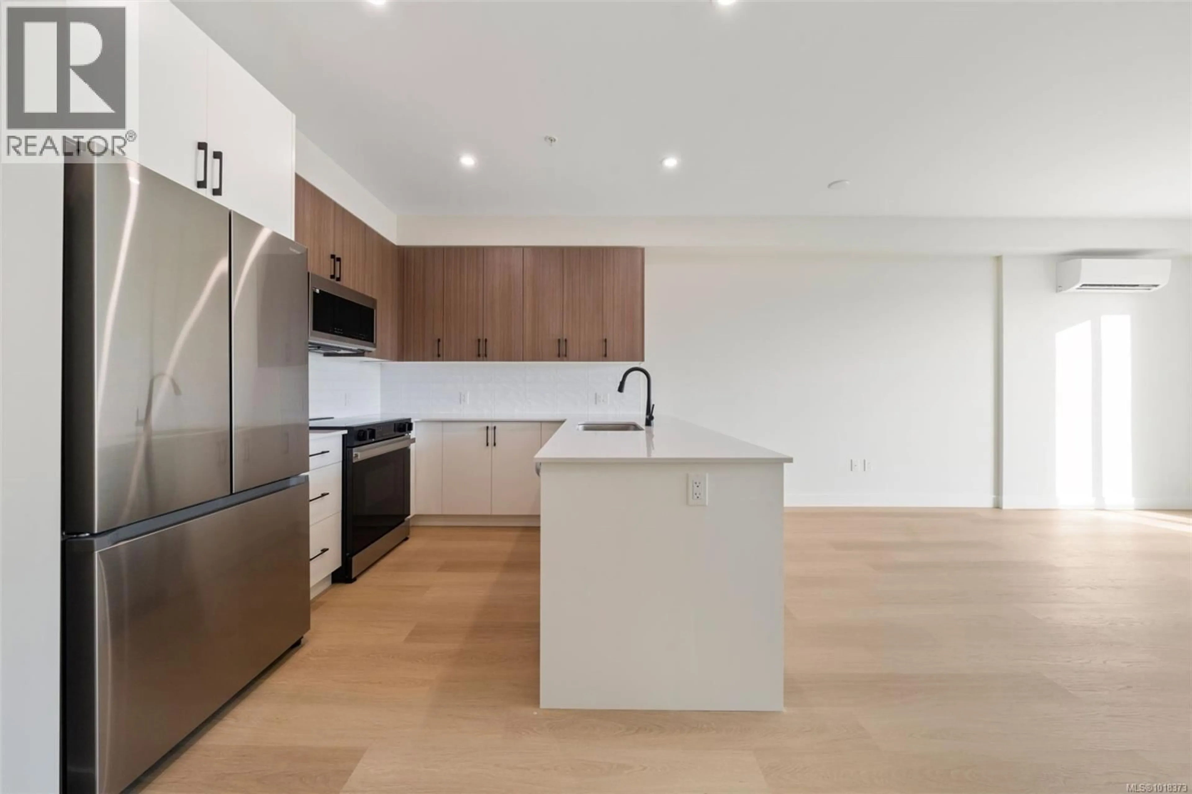 Open concept kitchen, wood/laminate floor for 413 - 2770 WINSTER ROAD, Langford British Columbia V9B7C7