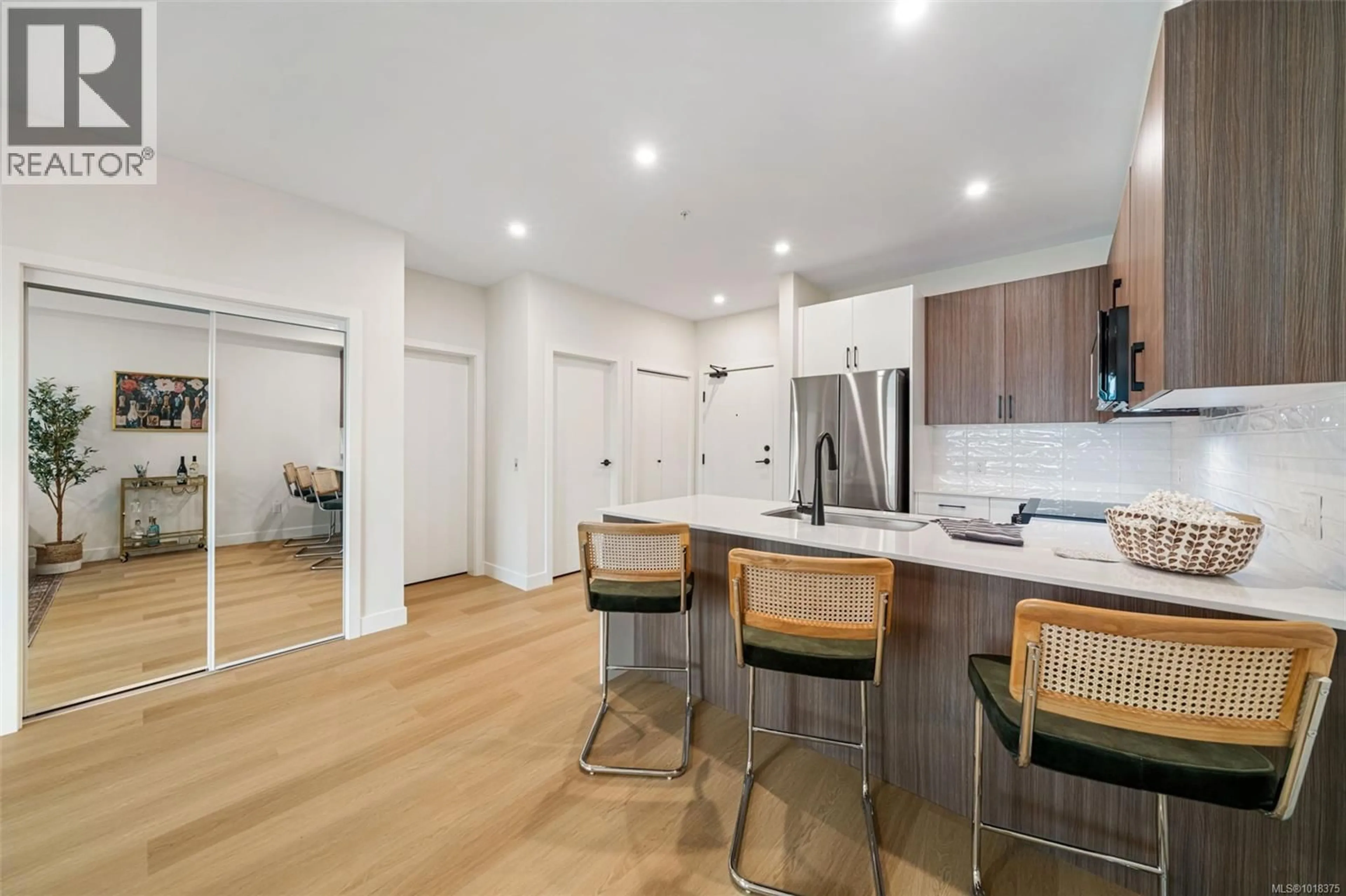 Open concept kitchen, wood/laminate floor for 408 - 2770 WINSTER ROAD, Langford British Columbia V9B7C7