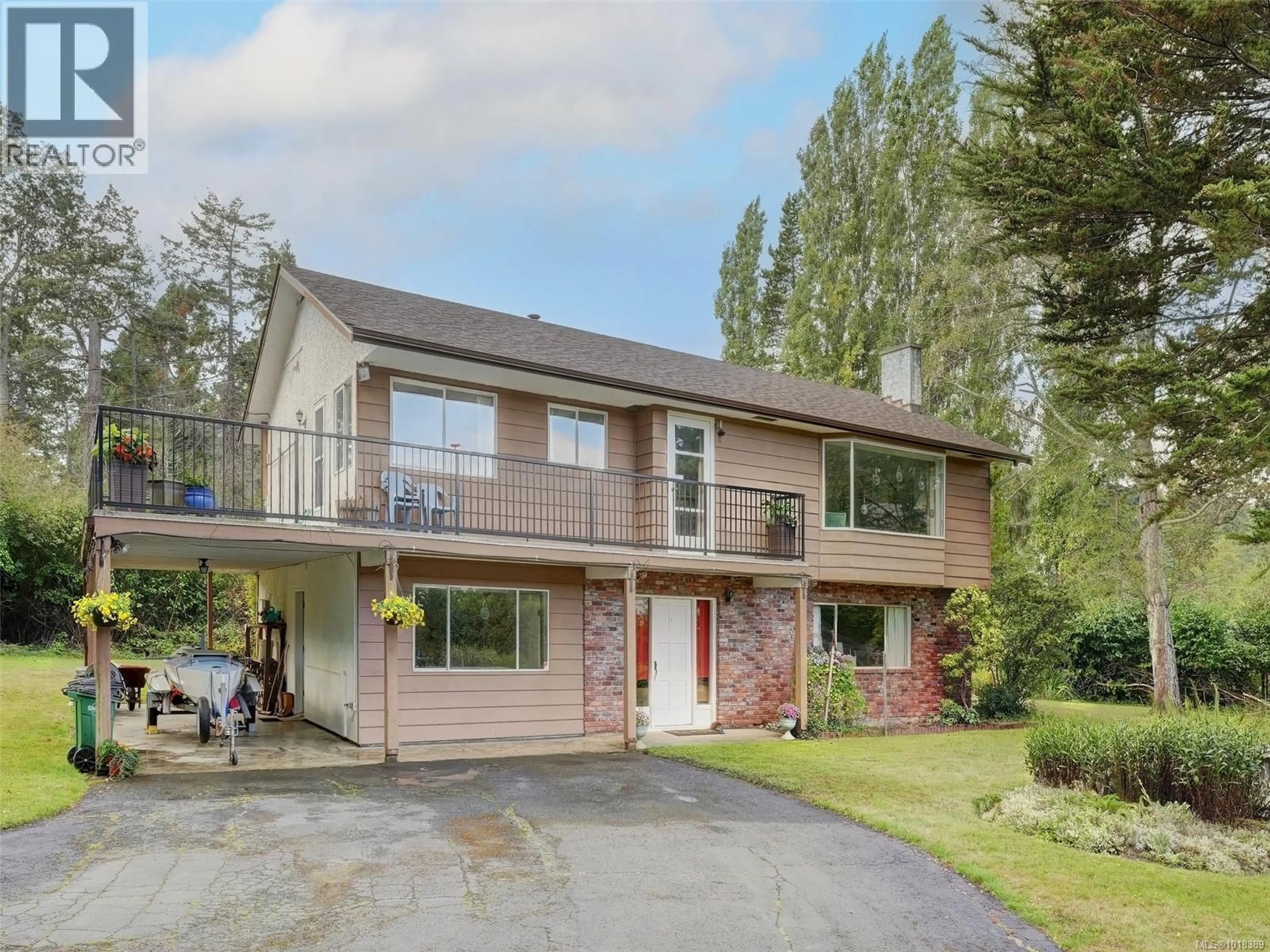 Home with brick exterior material, street for 1575 MILEVA LANE, Saanich British Columbia V8N2V6