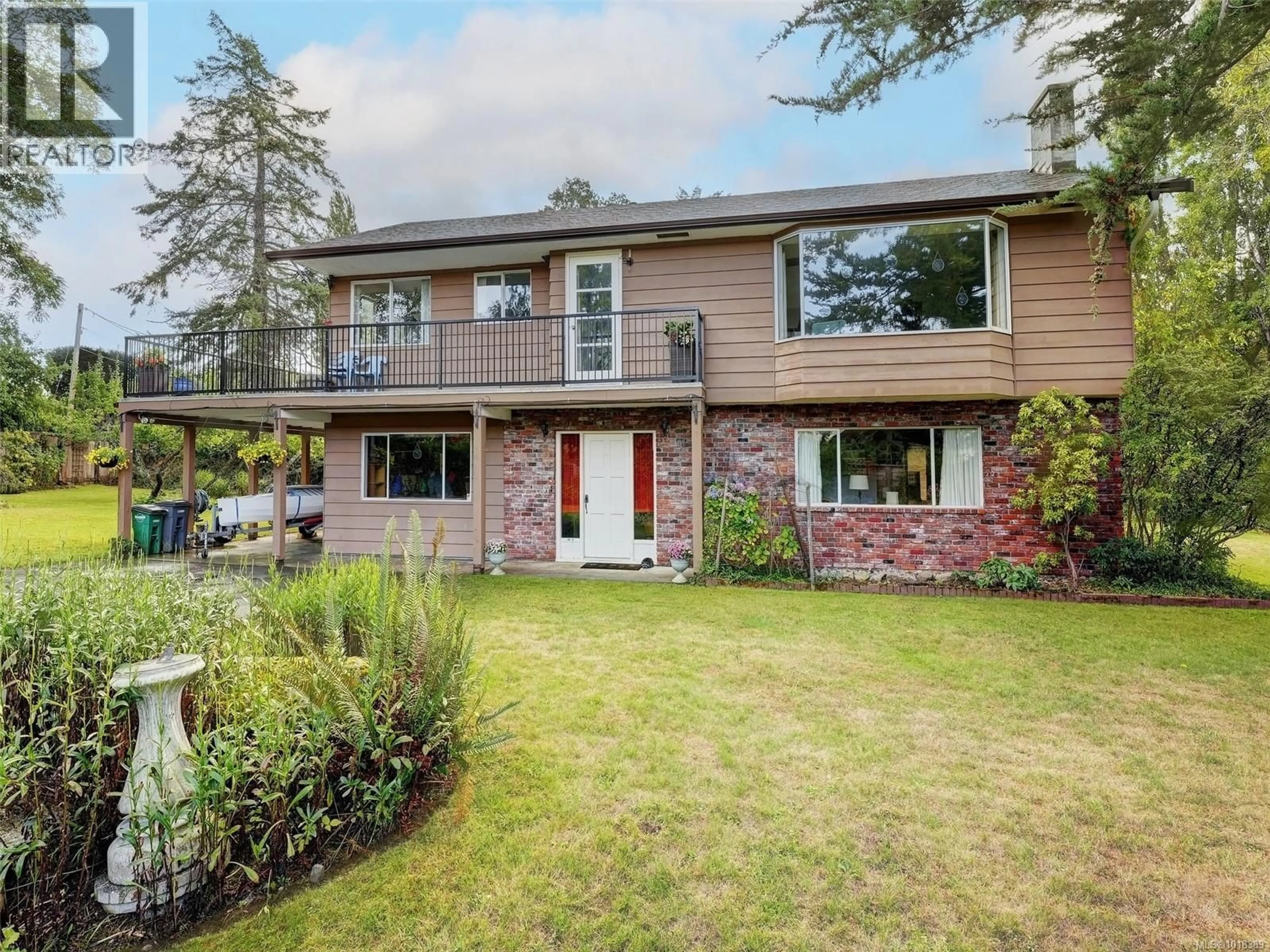 Home with brick exterior material, street for 1575 MILEVA LANE, Saanich British Columbia V8N2V6