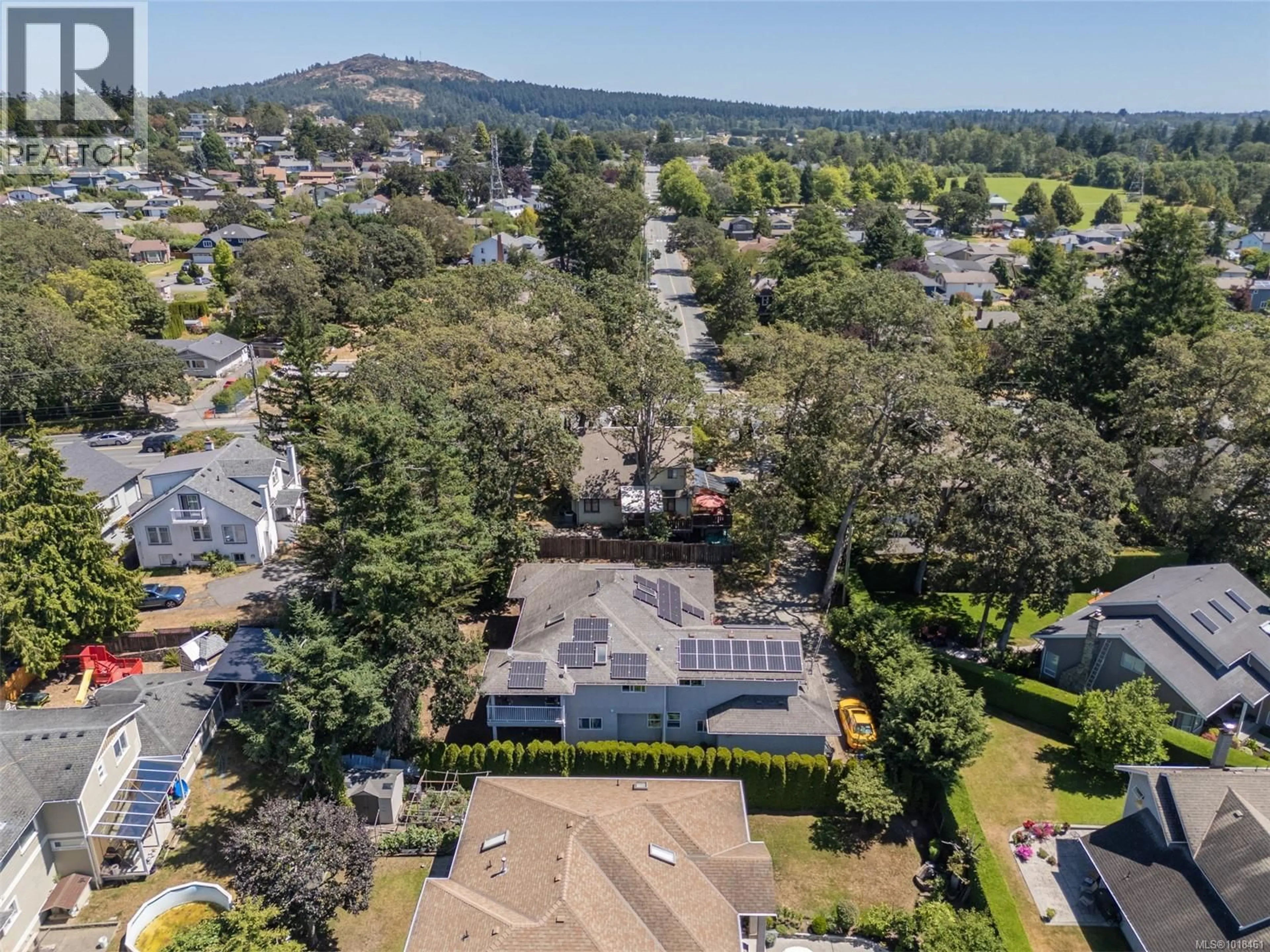 A pic from outside/outdoor area/front of a property/back of a property/a pic from drone, mountain view for 4202 QUADRA STREET, Saanich British Columbia V8X1L4