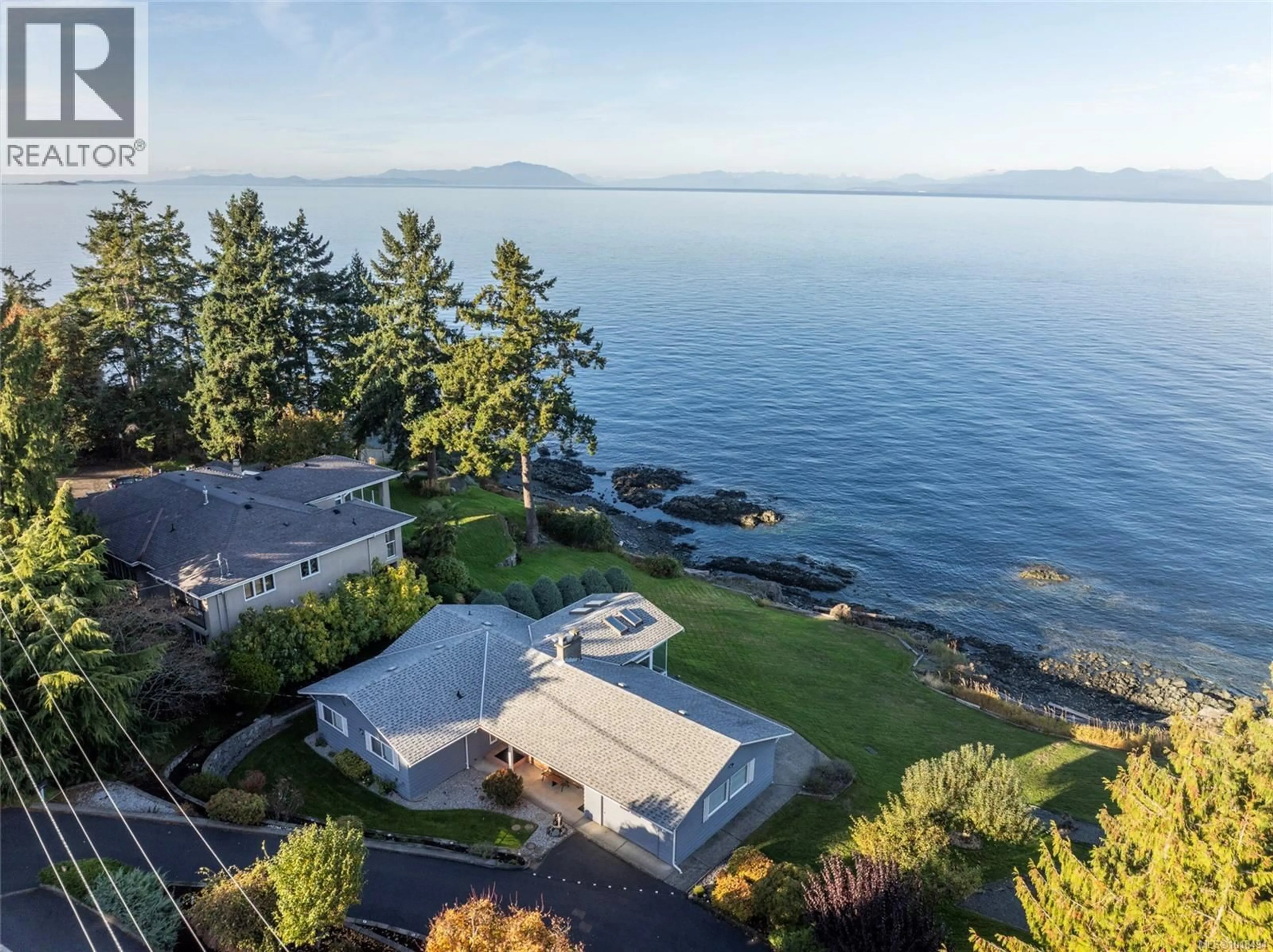 A pic from outside/outdoor area/front of a property/back of a property/a pic from drone, water/lake/river/ocean view for 5020/5010 FILLINGER CRESCENT, Nanaimo British Columbia V9V1J1