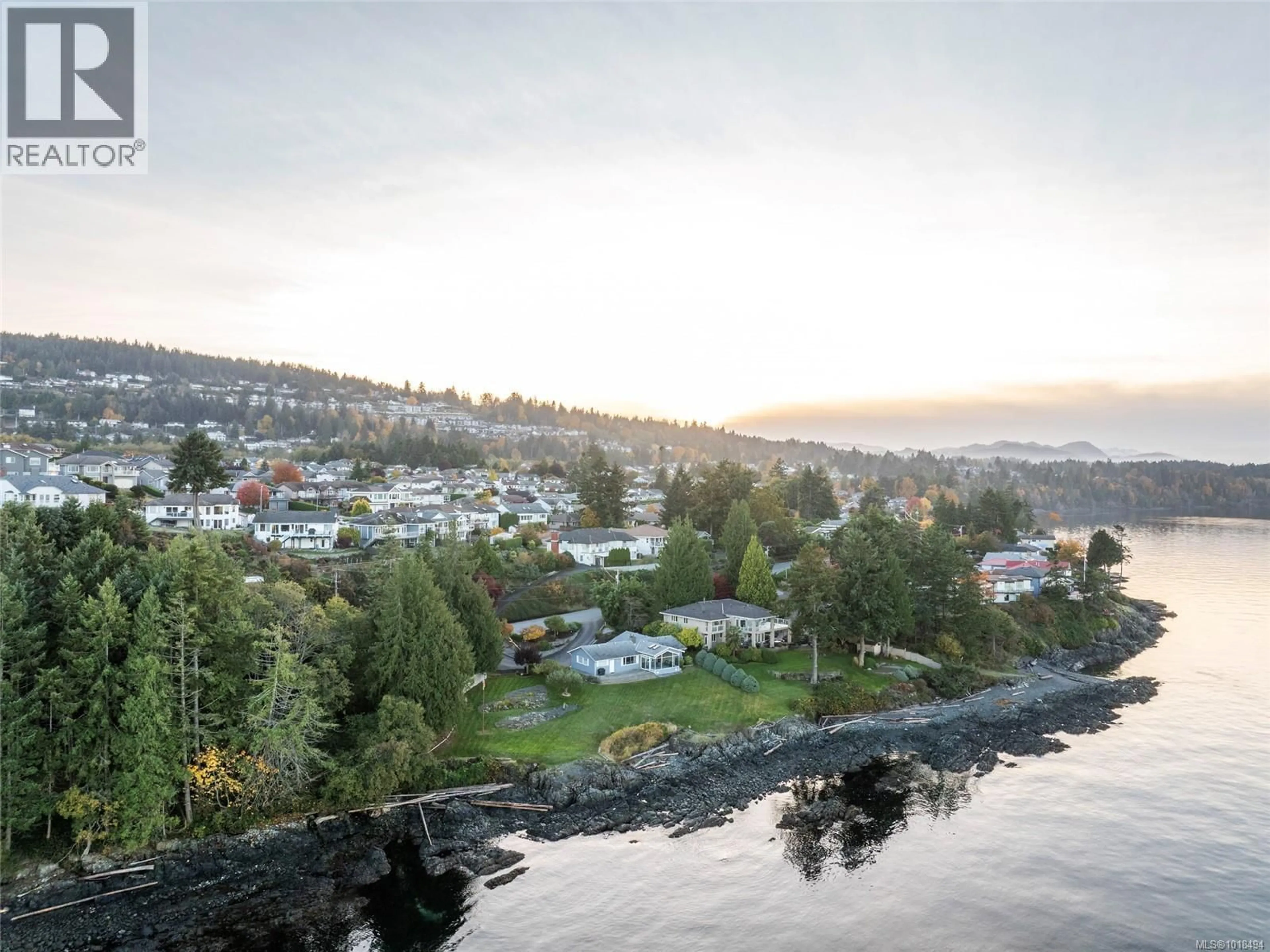 A pic from outside/outdoor area/front of a property/back of a property/a pic from drone, water/lake/river/ocean view for 5020/5010 FILLINGER CRESCENT, Nanaimo British Columbia V9V1J1
