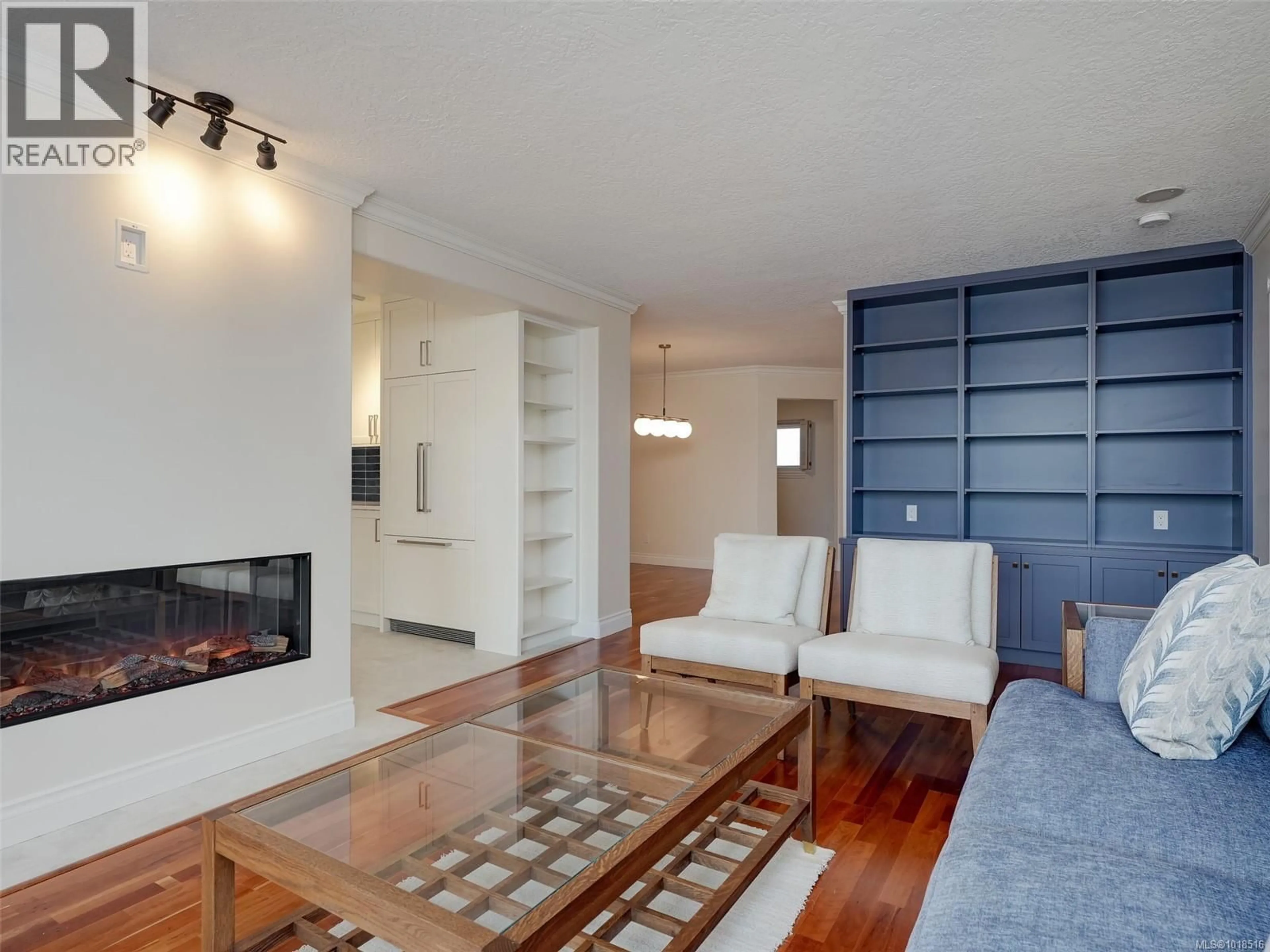 Living room with furniture, wood/laminate floor for 803 - 75 SONGHEES ROAD, Victoria British Columbia V9A7M5