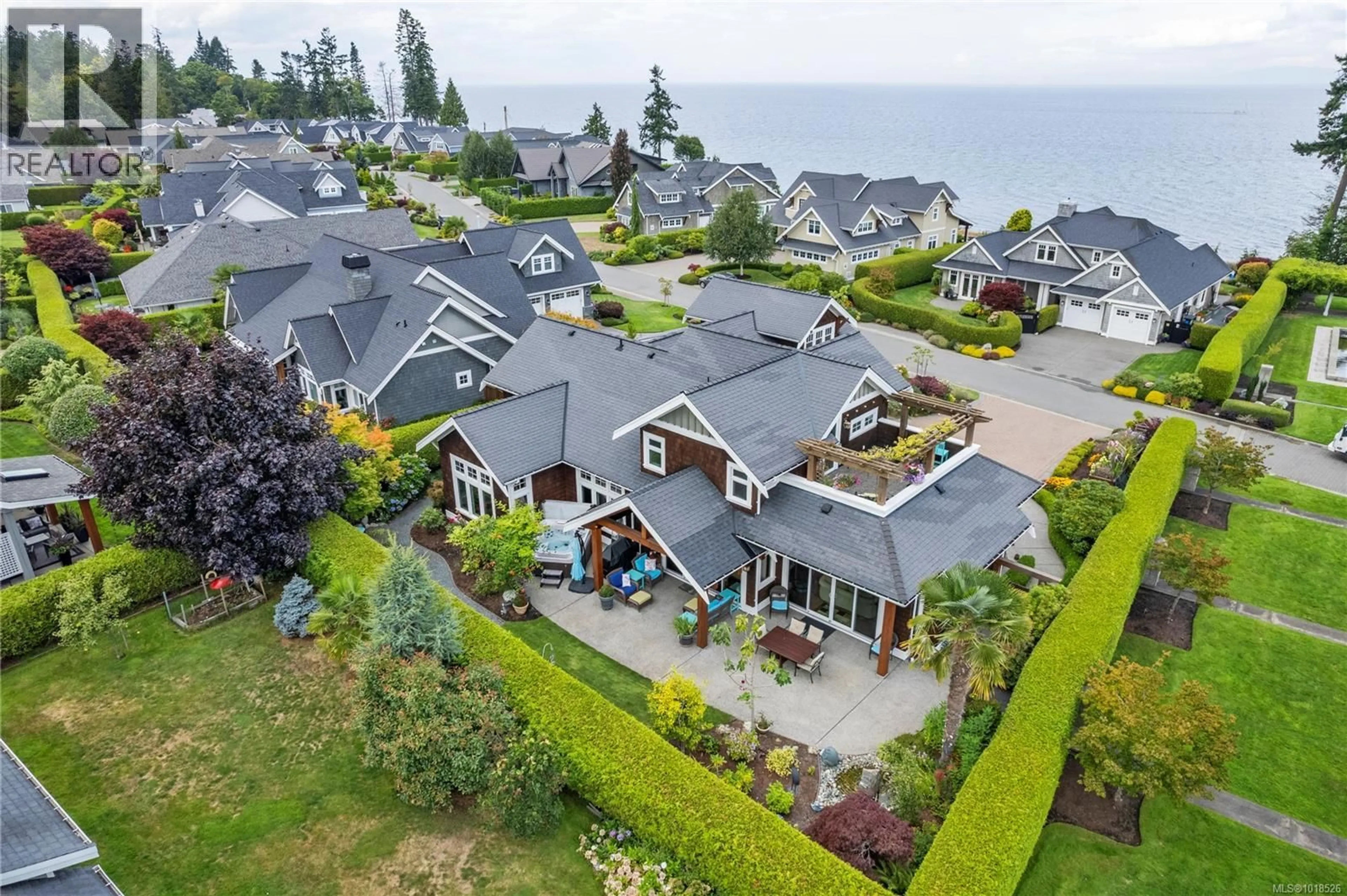 A pic from outside/outdoor area/front of a property/back of a property/a pic from drone, water/lake/river/ocean view for 942 BLUFFS DRIVE, Qualicum Beach British Columbia V9K0A2