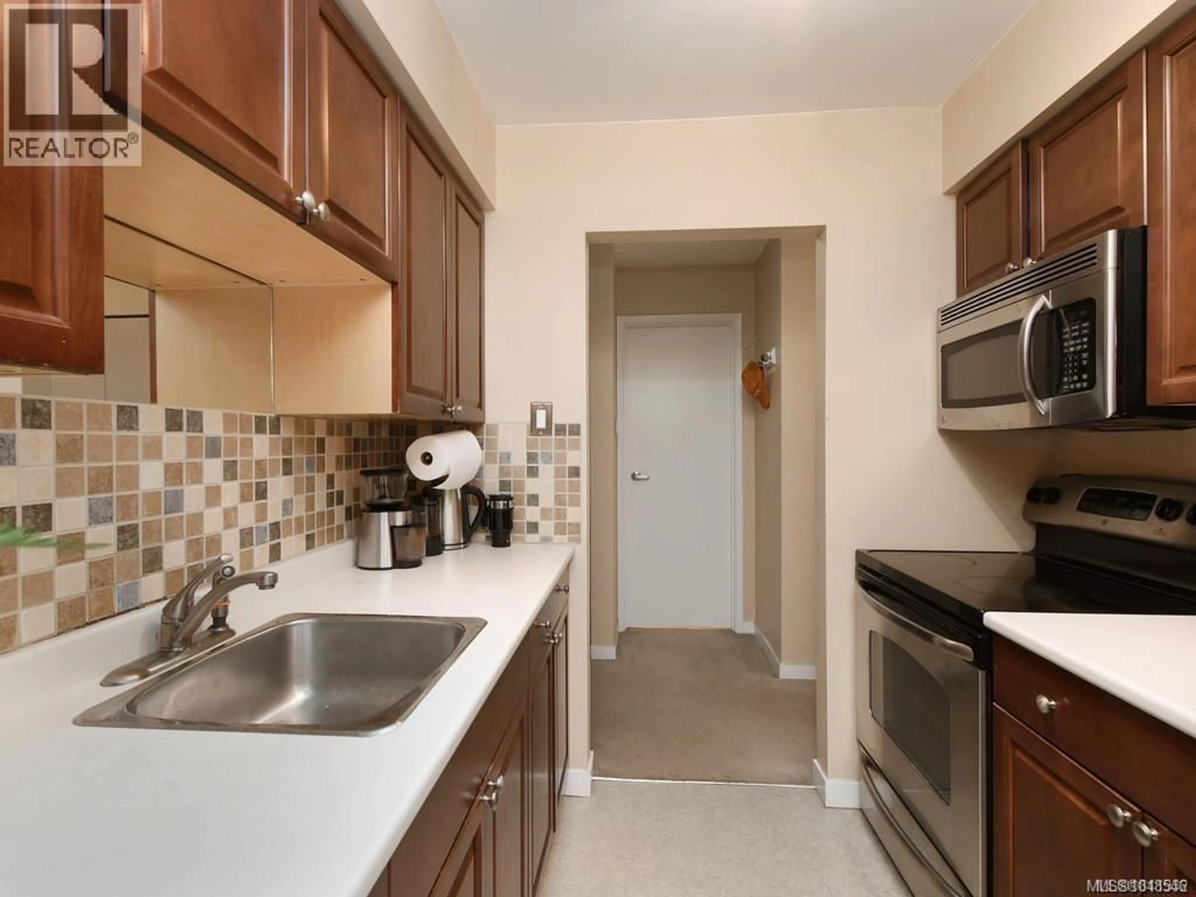 Standard kitchen, ceramic/tile floor for 303 - 1597 MIDGARD AVENUE, Saanich British Columbia V8P2Y2