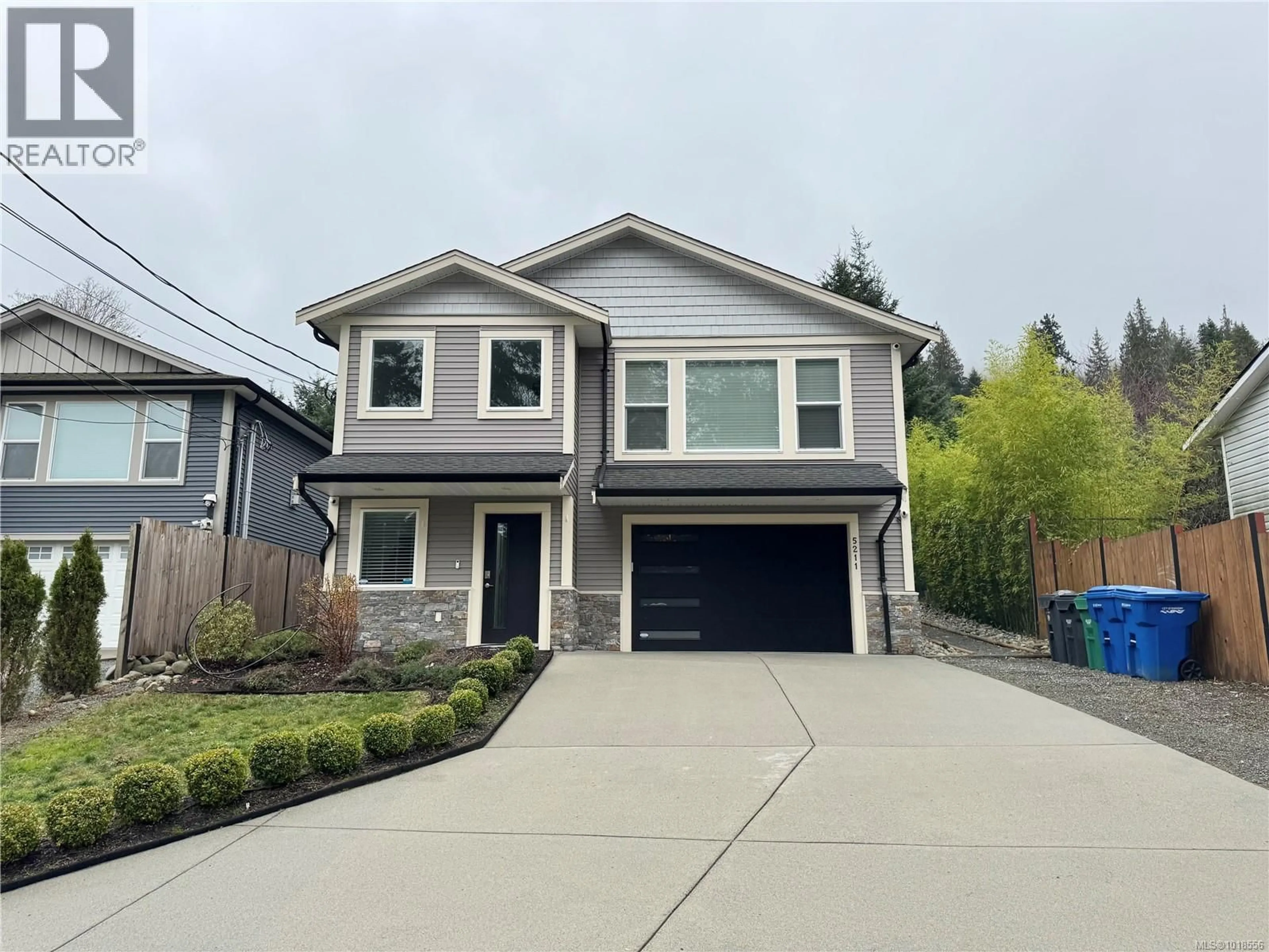 Home with vinyl exterior material, street for 5211 HAMMOND BAY ROAD, Nanaimo British Columbia V9T5M9
