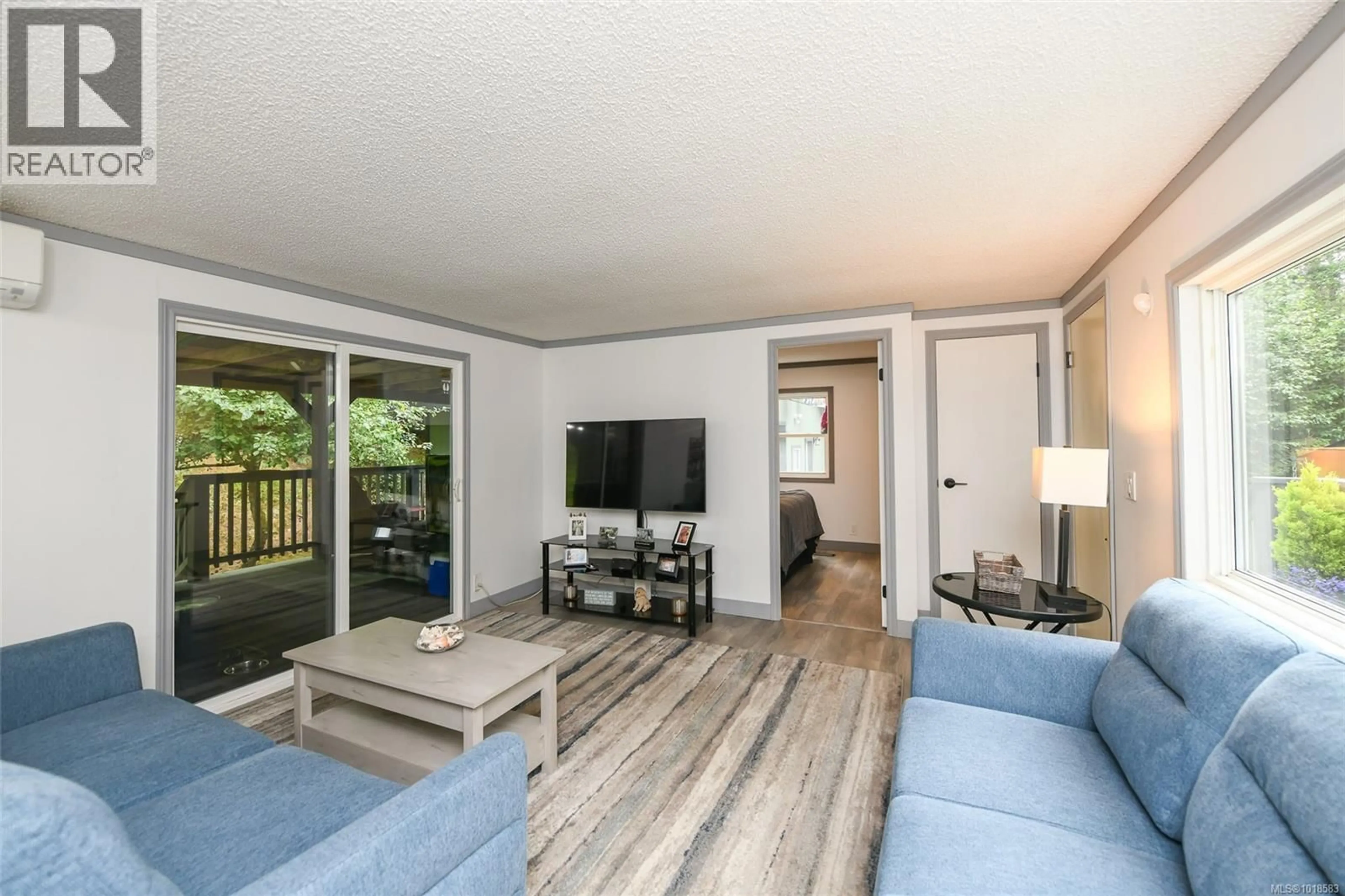 Living room with furniture, wood/laminate floor for 3701 ISLAND HIGHWAY SOUTH, Courtenay British Columbia V9N9T4