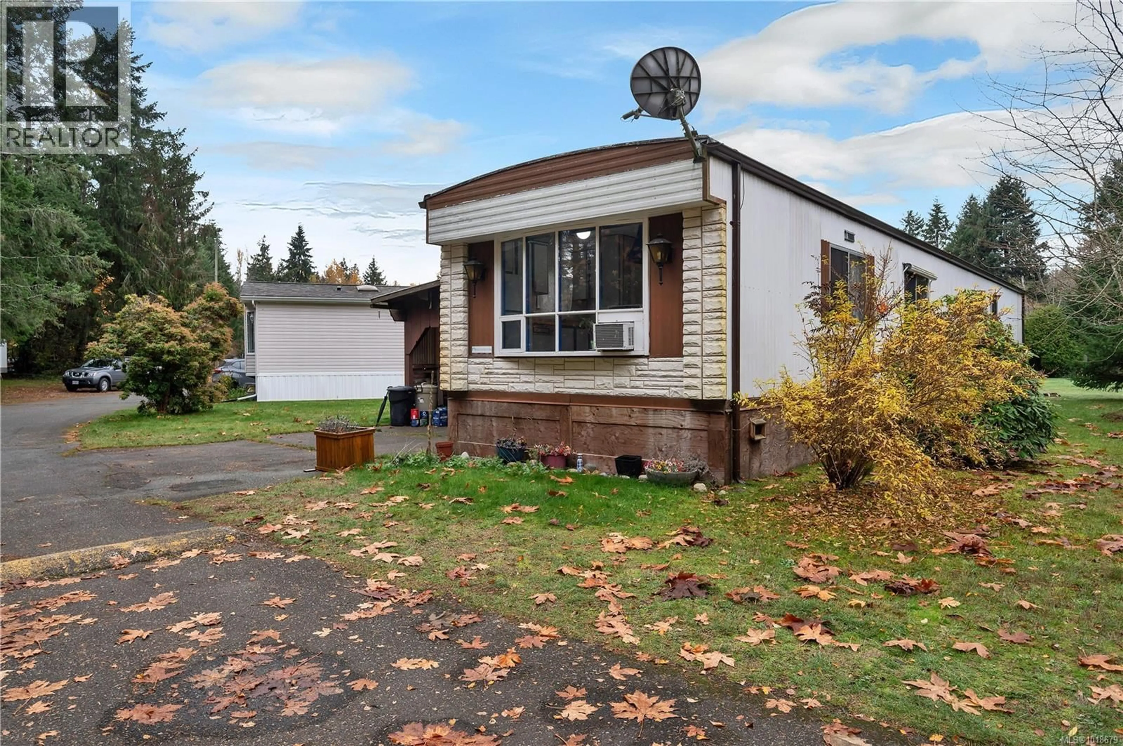 Home with vinyl exterior material, street for 8B - 2157 REGENT ROAD, Black Creek British Columbia V9J1K6