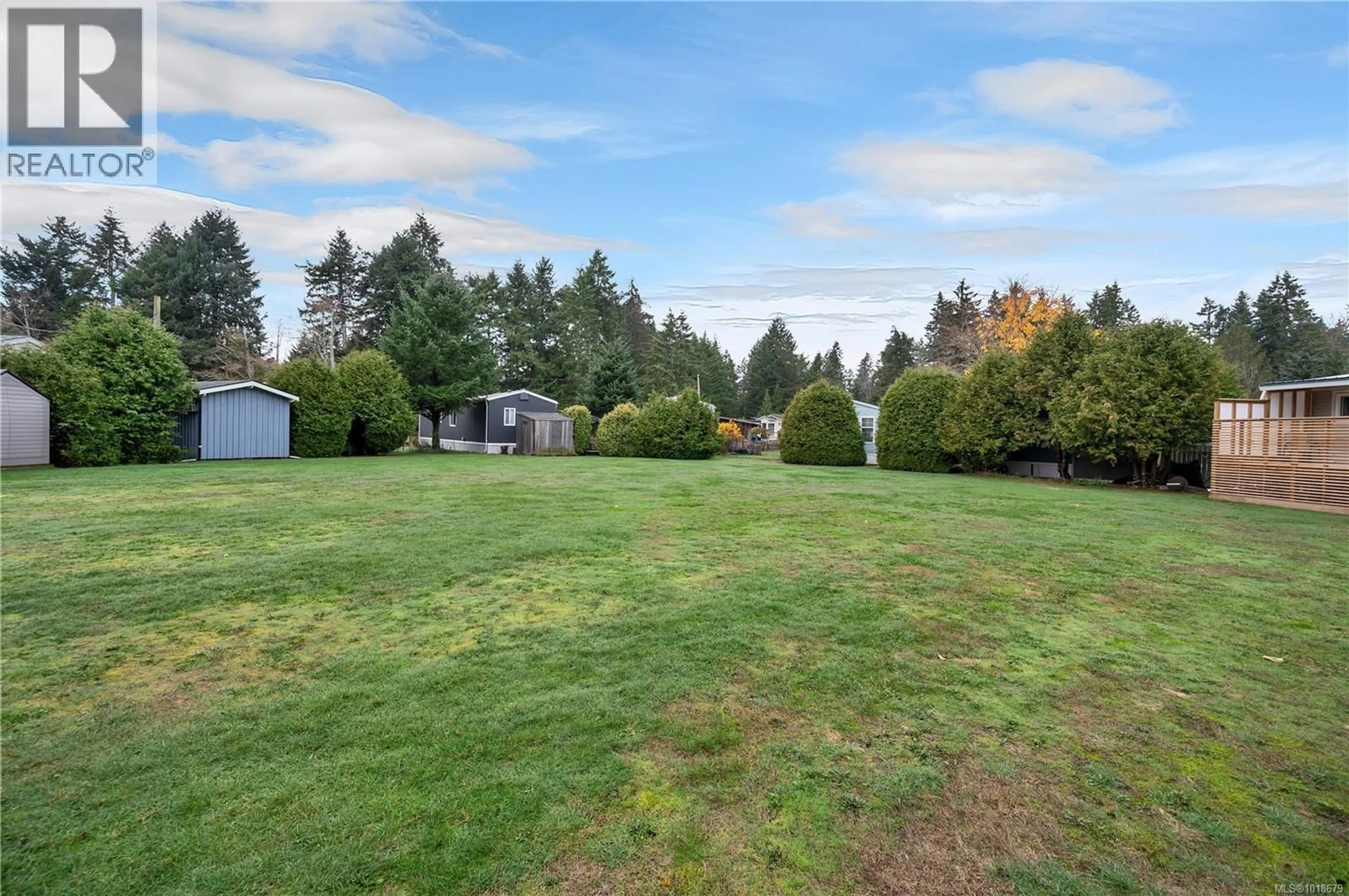 A pic from outside/outdoor area/front of a property/back of a property/a pic from drone, unknown for 8B - 2157 REGENT ROAD, Black Creek British Columbia V9J1K6