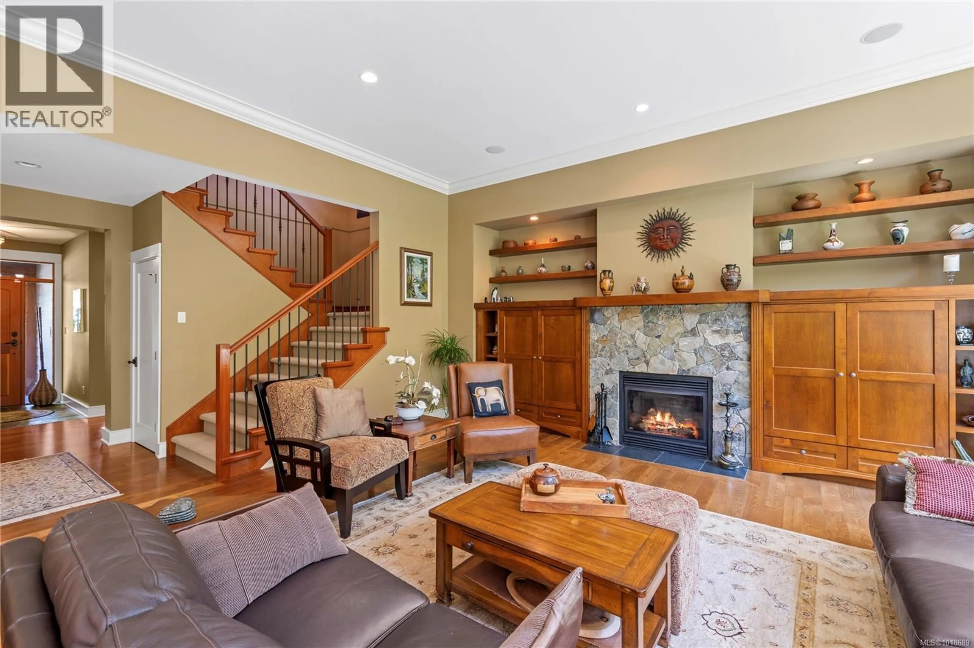Living room with furniture, wood/laminate floor for 649 EAGLEWOOD COURT, Qualicum Beach British Columbia V9K0A3