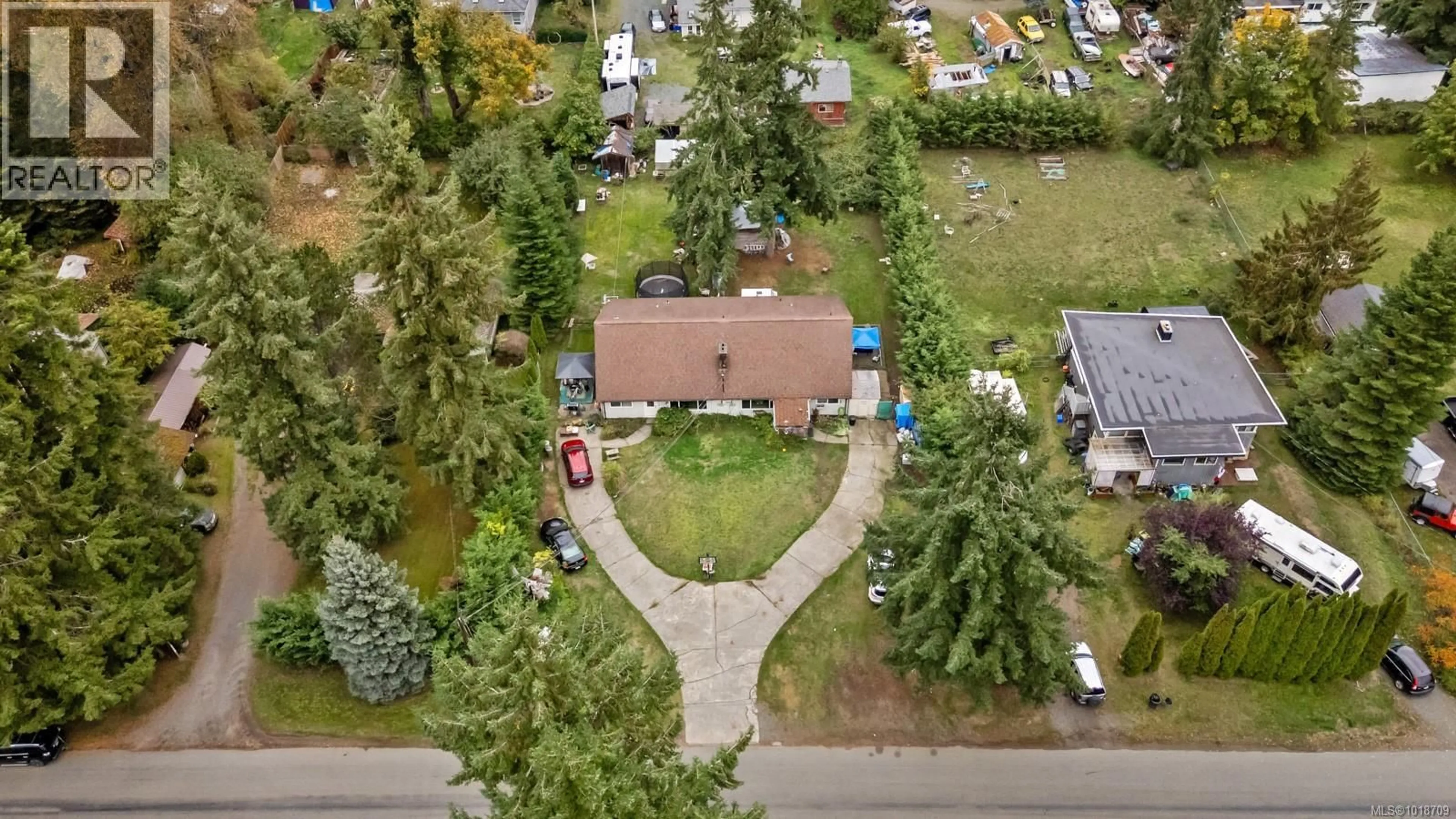 A pic from outside/outdoor area/front of a property/back of a property/a pic from drone, street for 4792 LEWIS ROAD, Campbell River British Columbia V9H1C4