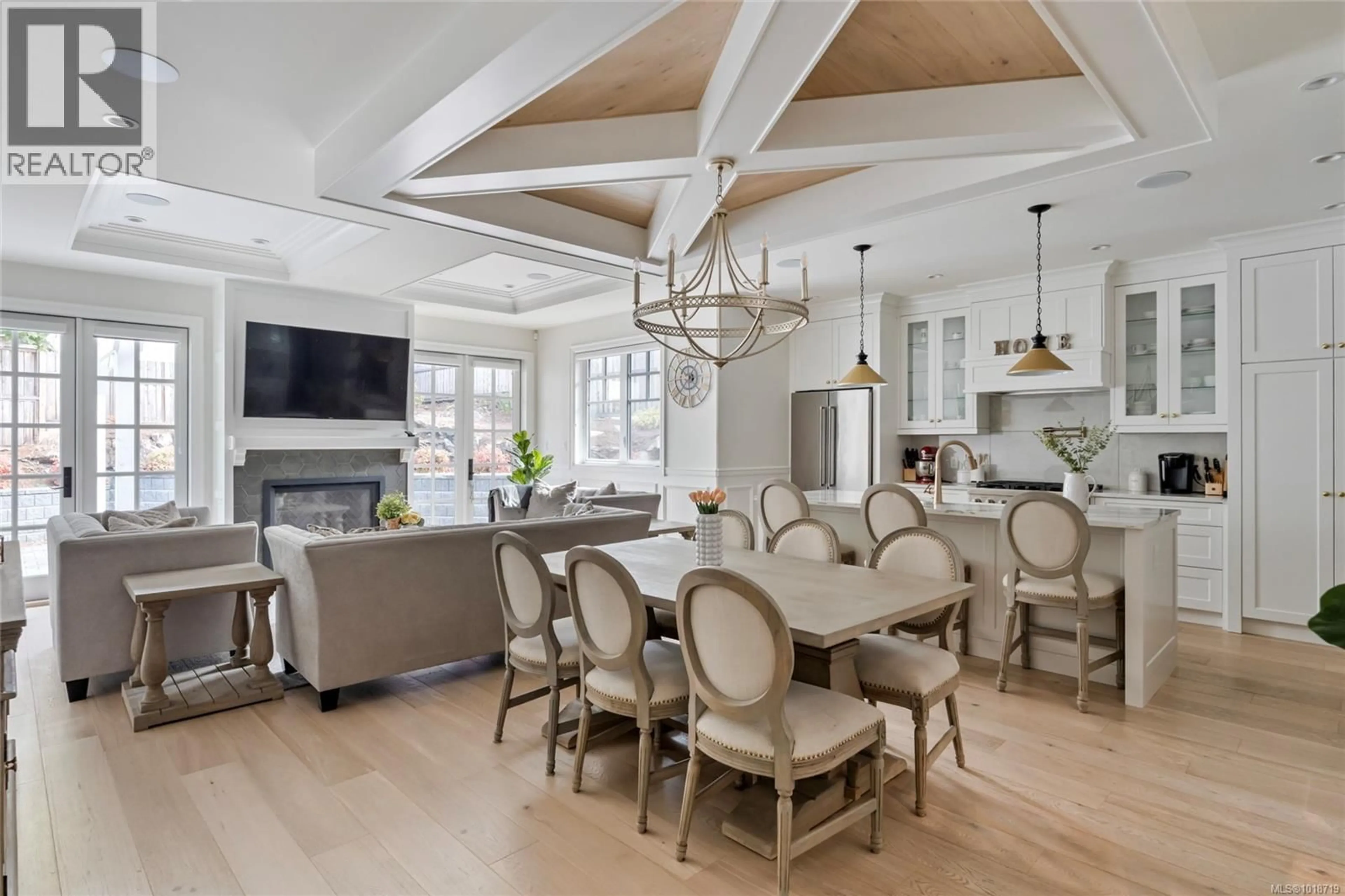 Open concept kitchen, wood/laminate floor for 4829 CORDOVA BAY ROAD, Saanich British Columbia V8Y2J8