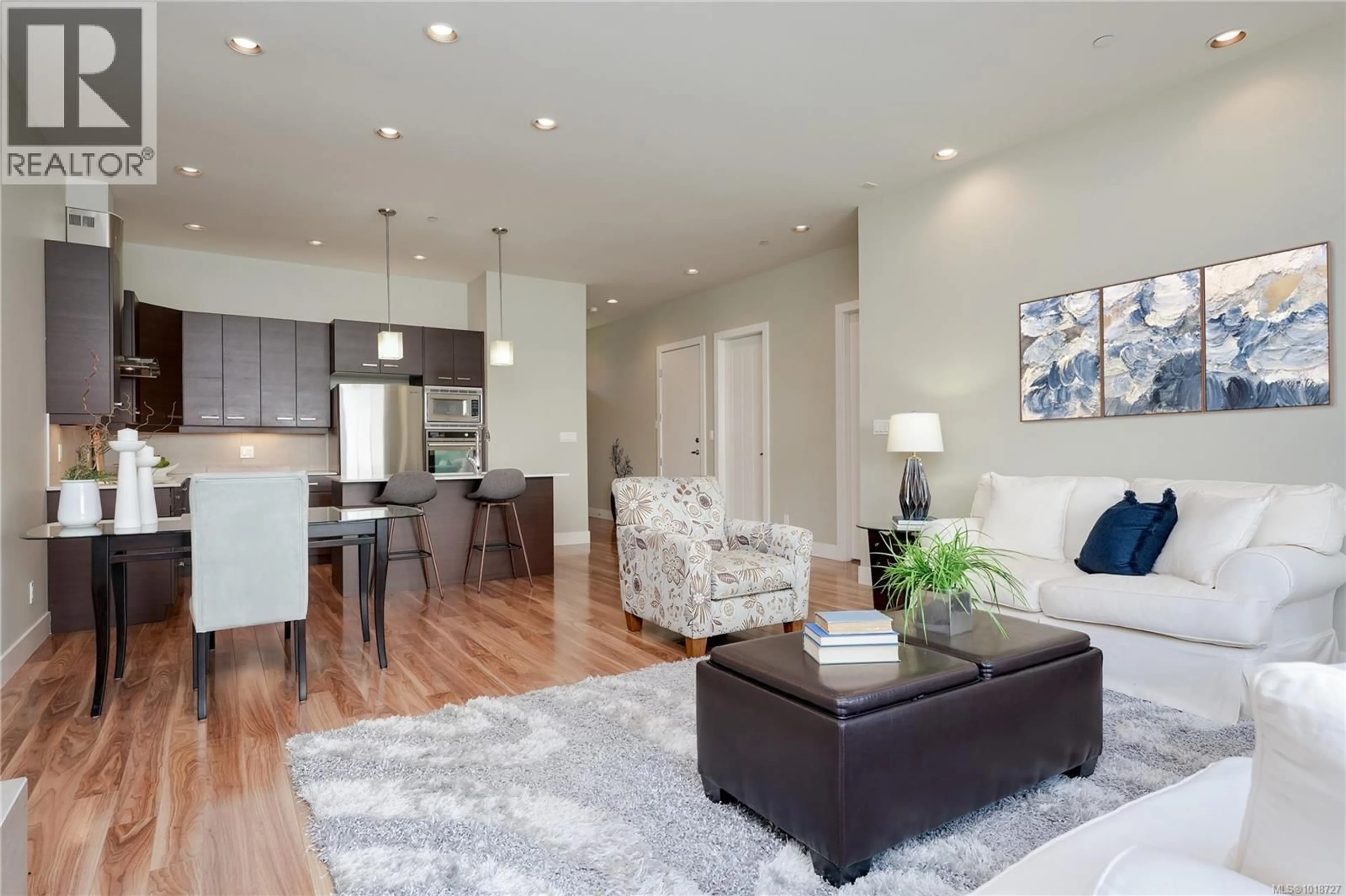 Living room with furniture, wood/laminate floor for 134 - 3640 PROPELLER PLACE, Colwood British Columbia V9C0A4