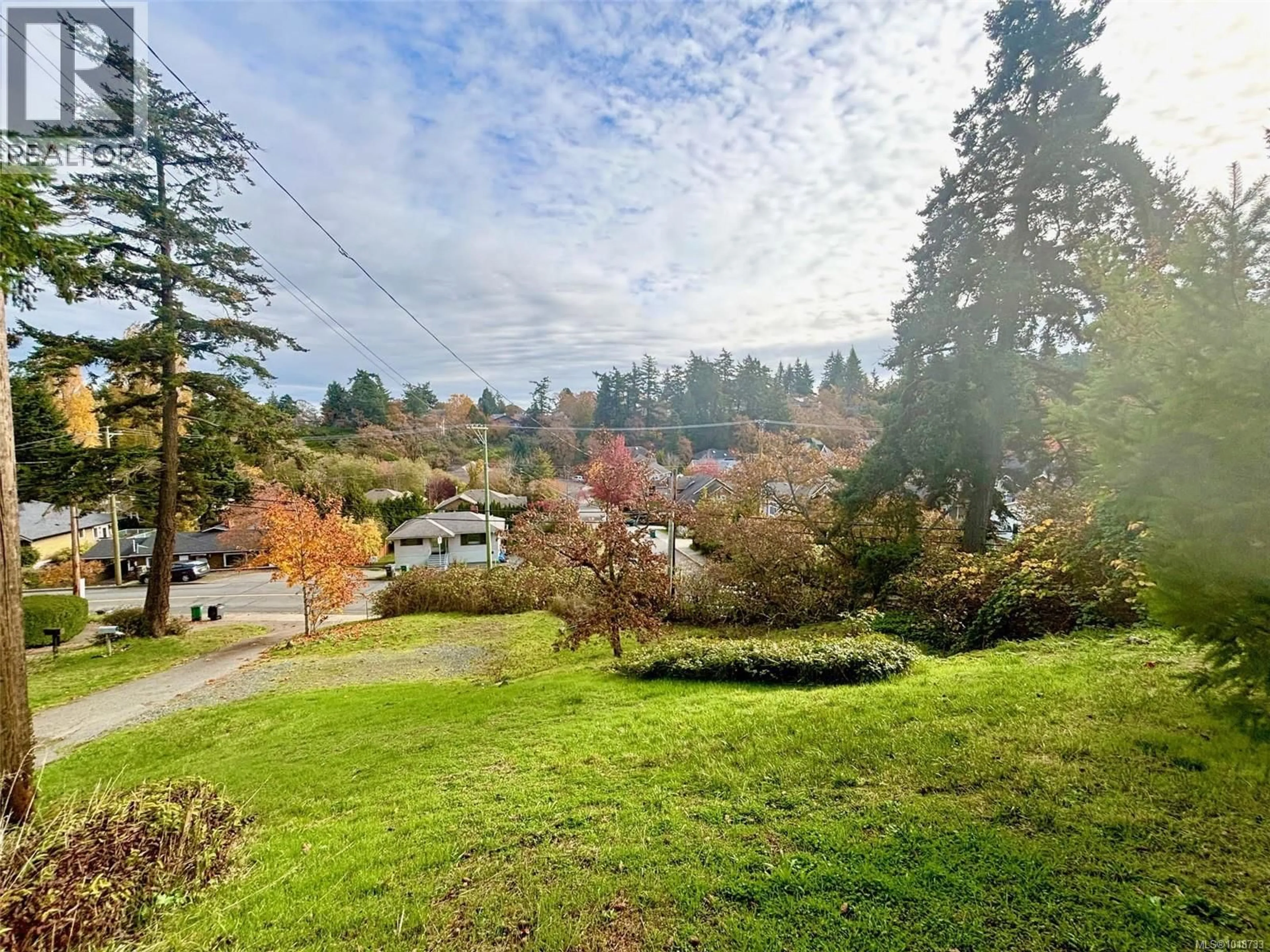 A pic from outside/outdoor area/front of a property/back of a property/a pic from drone, forest/trees view for 3904 WILKINSON ROAD, Saanich British Columbia V8Z5A2
