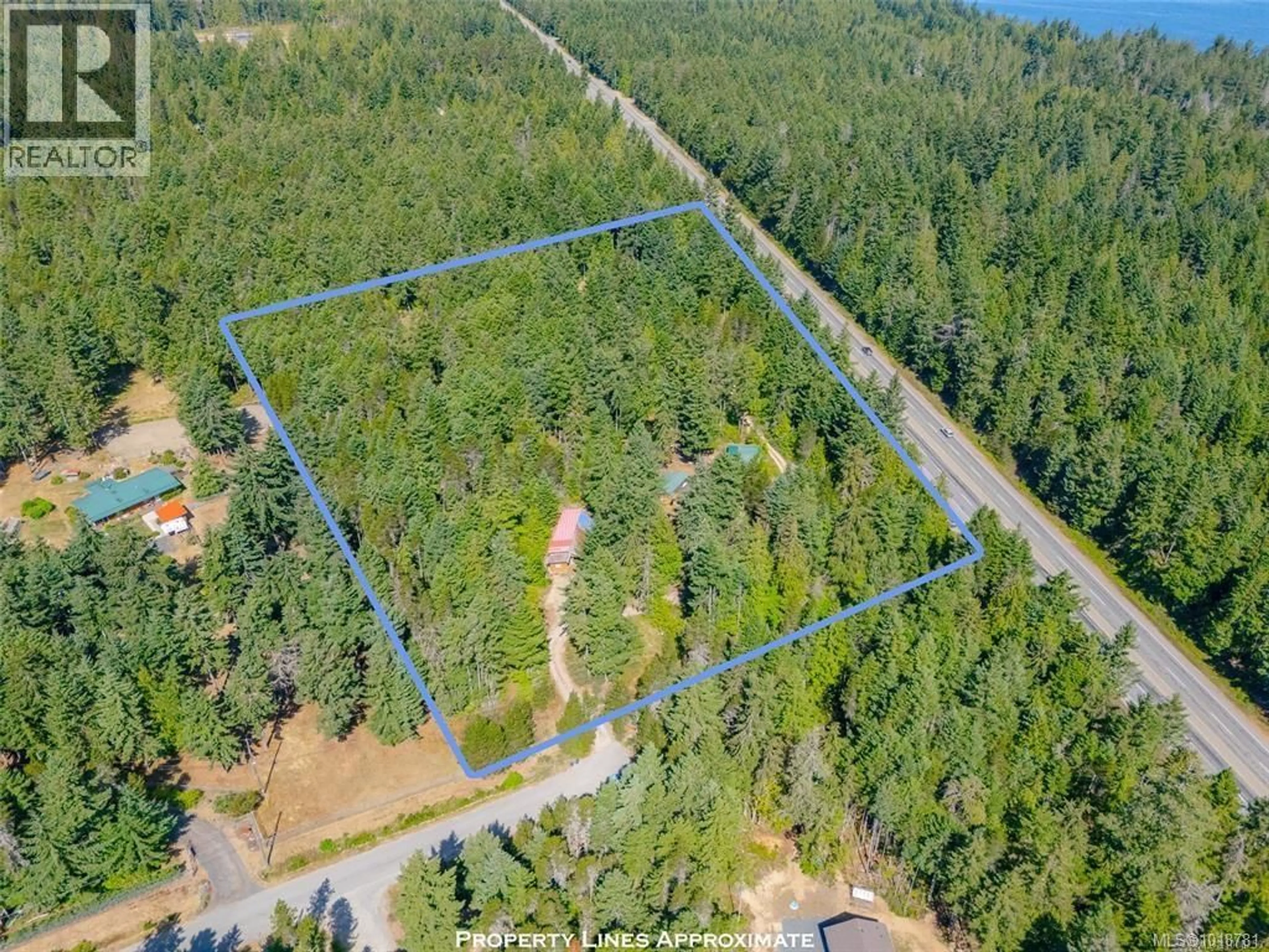 A pic from outside/outdoor area/front of a property/back of a property/a pic from drone, forest/trees view for 300 OAKDOWNE ROAD, Qualicum Beach British Columbia V9K2G1