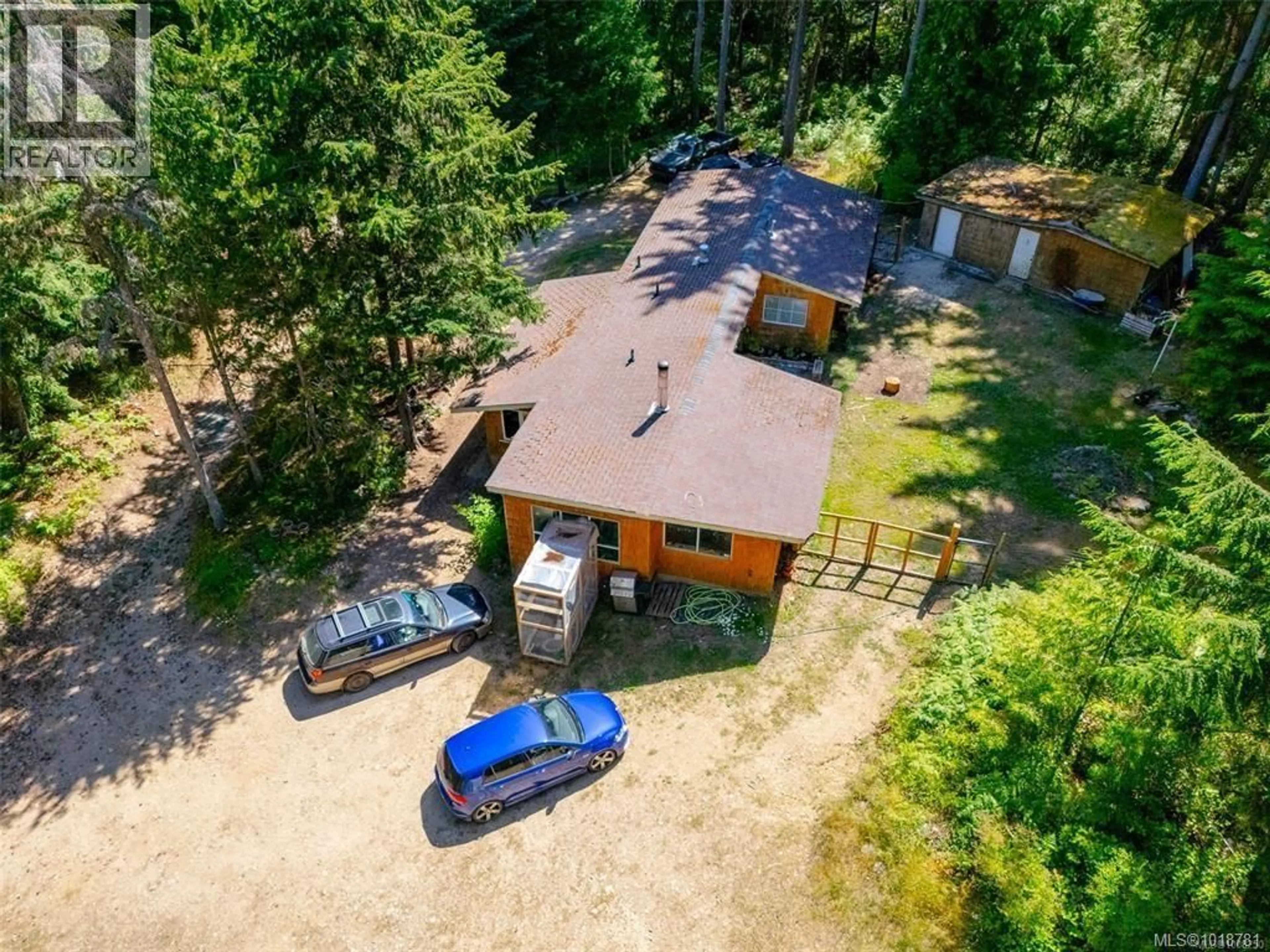 A pic from outside/outdoor area/front of a property/back of a property/a pic from drone, forest/trees view for 300 OAKDOWNE ROAD, Qualicum Beach British Columbia V9K2G1