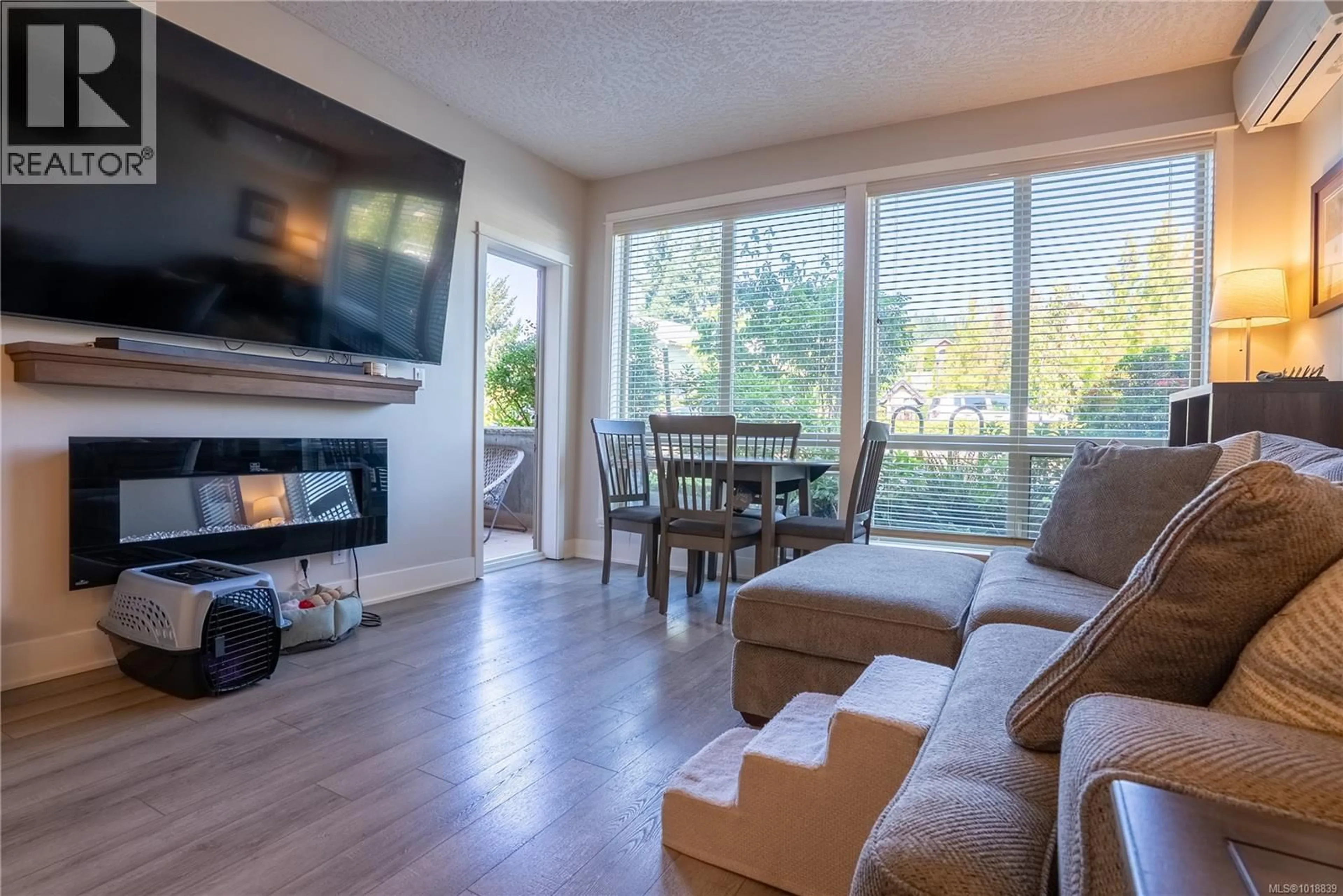 Living room with furniture, wood/laminate floor for 103 - 631 BROOKSIDE ROAD, Colwood British Columbia V9C0C3