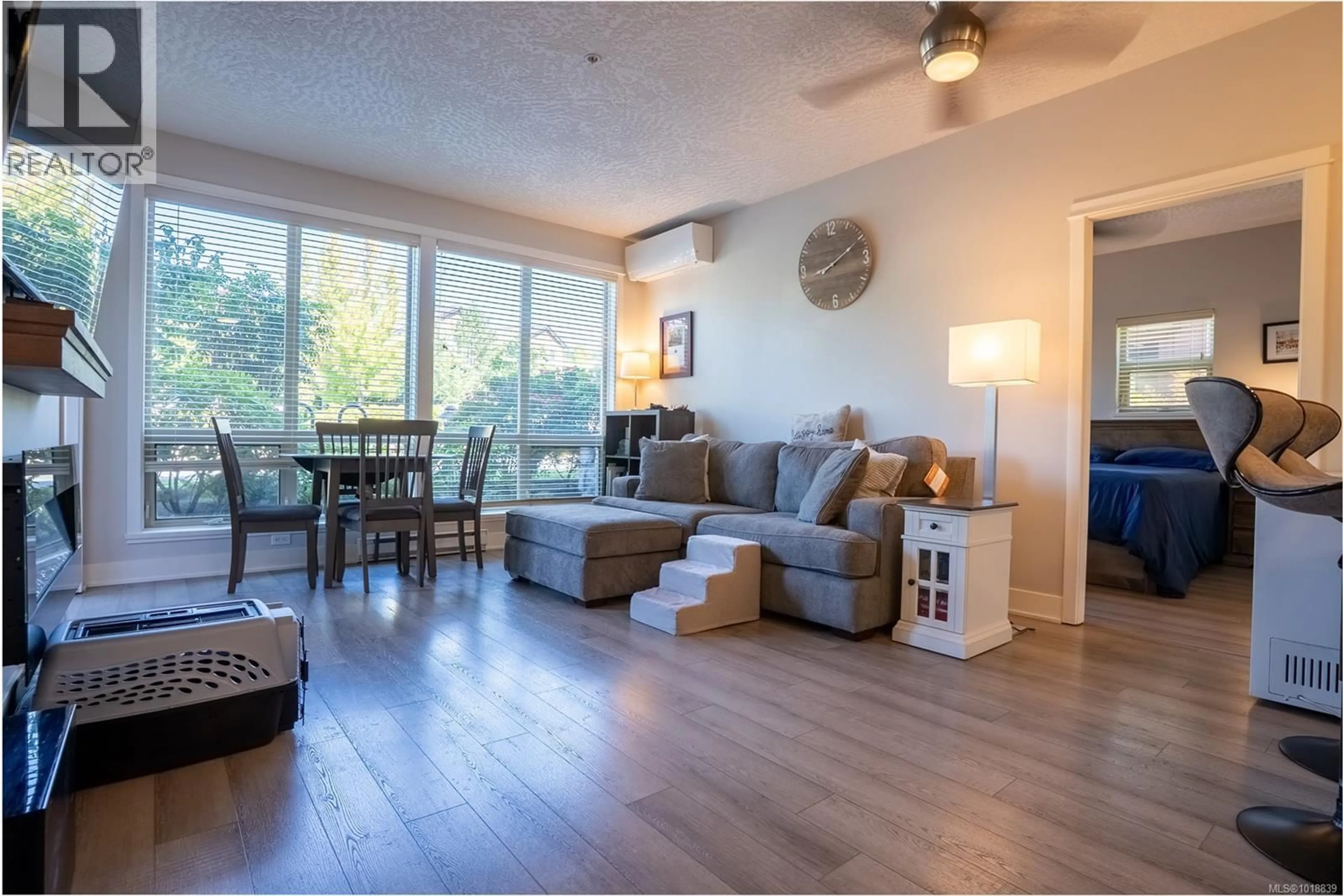Living room with furniture, wood/laminate floor for 103 - 631 BROOKSIDE ROAD, Colwood British Columbia V9C0C3