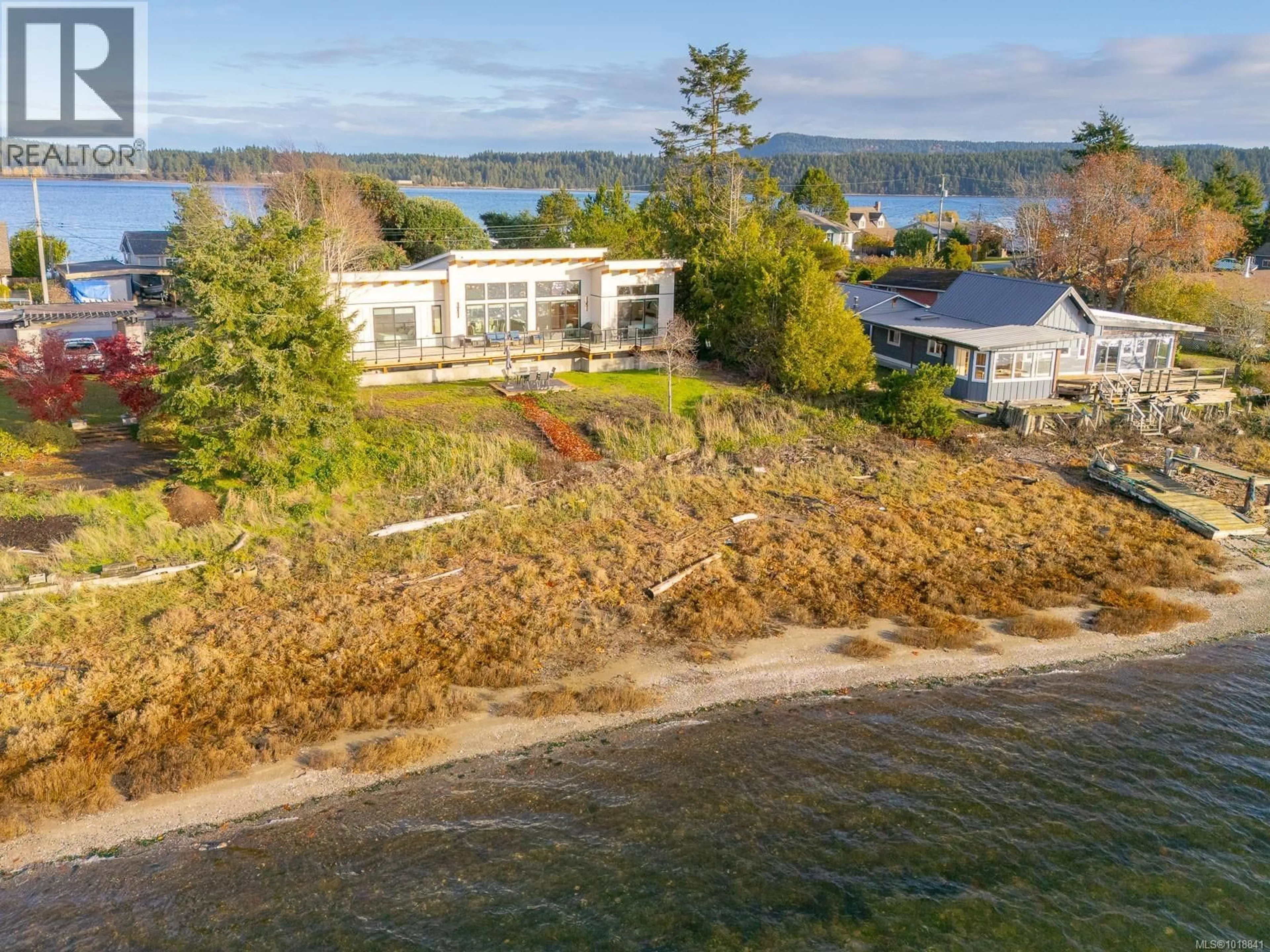 A pic from outside/outdoor area/front of a property/back of a property/a pic from drone, water/lake/river/ocean view for 5496 DEEP BAY DRIVE, Bowser British Columbia V0R1G9