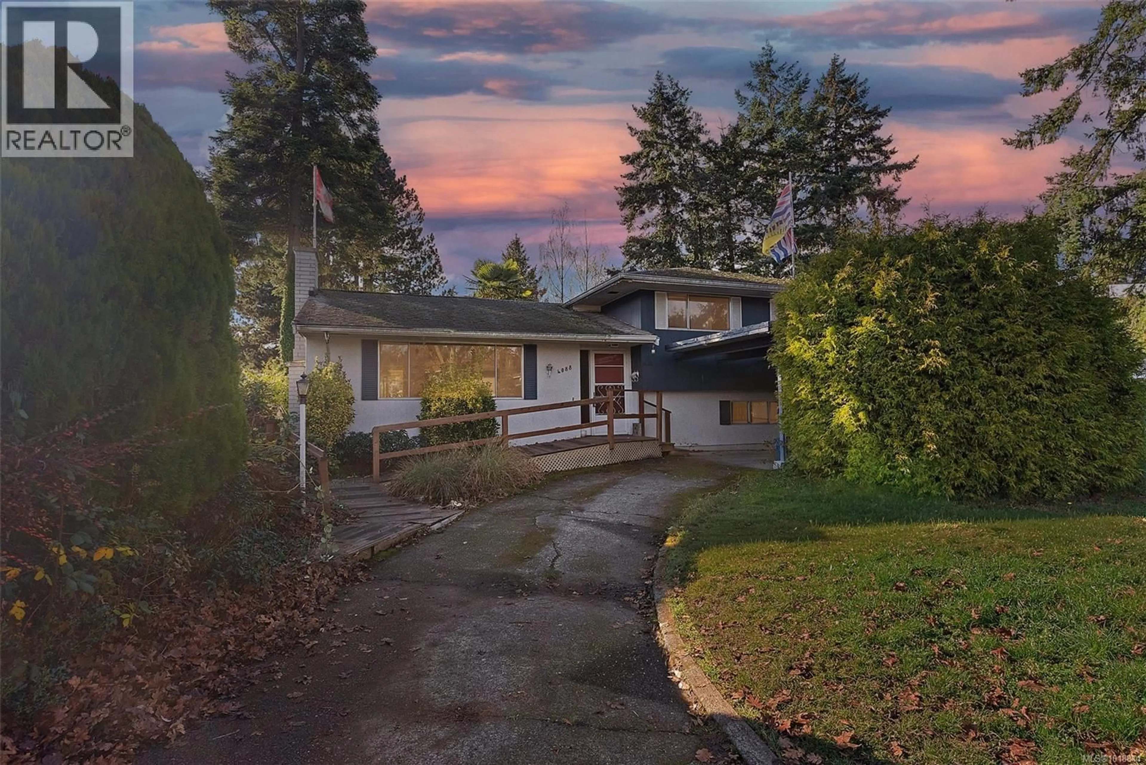 A pic from outside/outdoor area/front of a property/back of a property/a pic from drone, street for 4088 CEDAR HILL CROSS ROAD, Saanich British Columbia V8X2J3