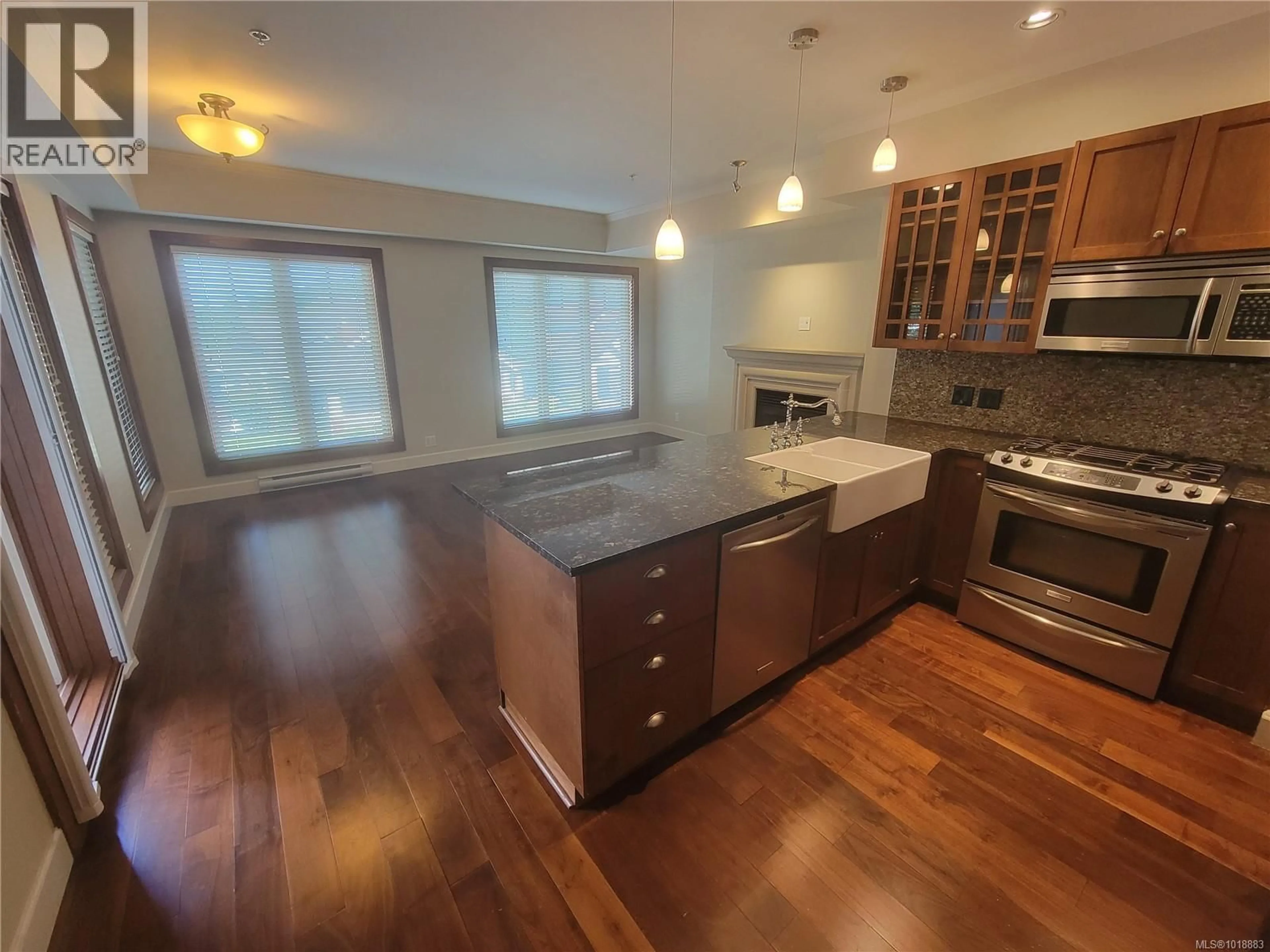 Open concept kitchen, wood/laminate floor for 205 - 2006 TROON COURT, Langford British Columbia V9B6T4