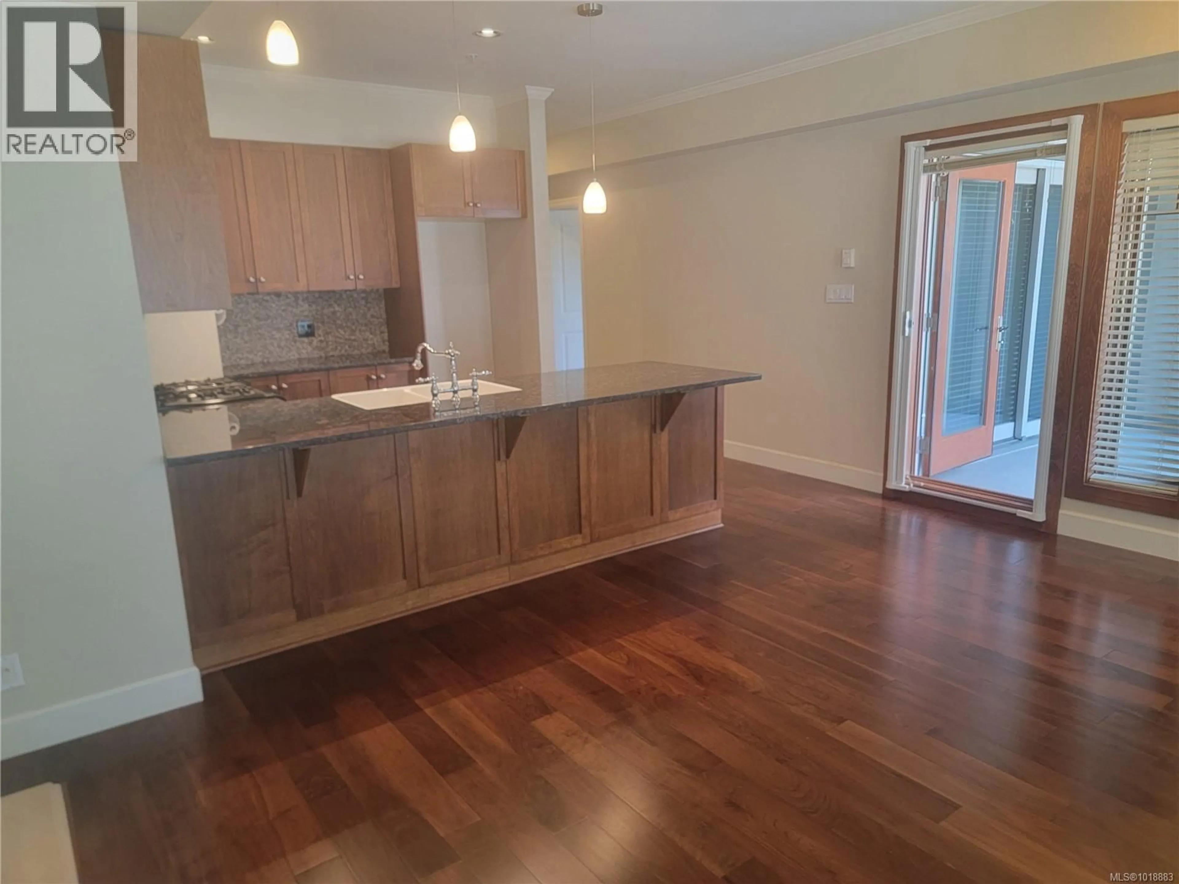 Open concept kitchen, wood/laminate floor for 205 - 2006 TROON COURT, Langford British Columbia V9B6T4