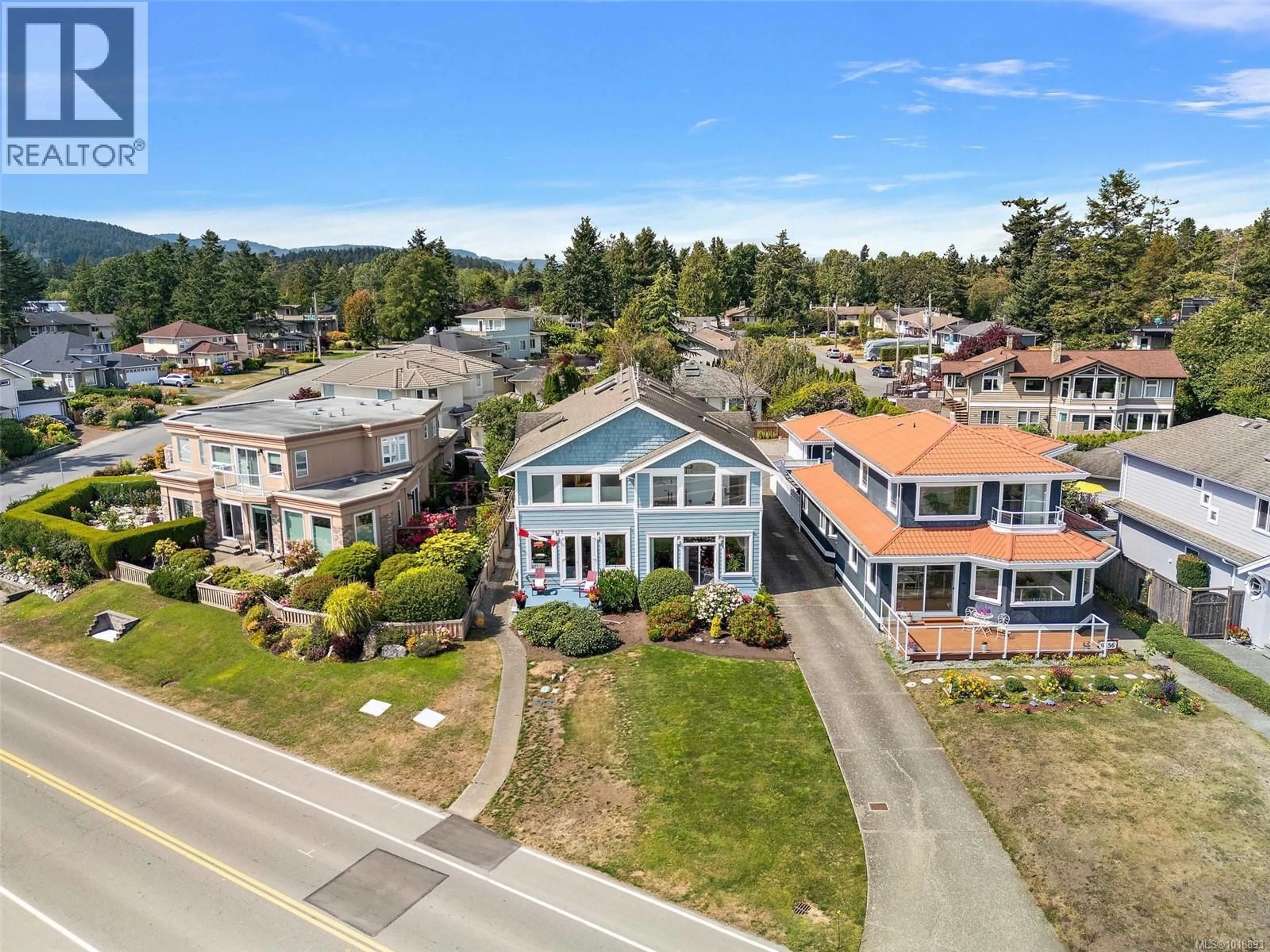A pic from outside/outdoor area/front of a property/back of a property/a pic from drone, street for 9452 LOCHSIDE DRIVE, Sidney British Columbia V8L1N8