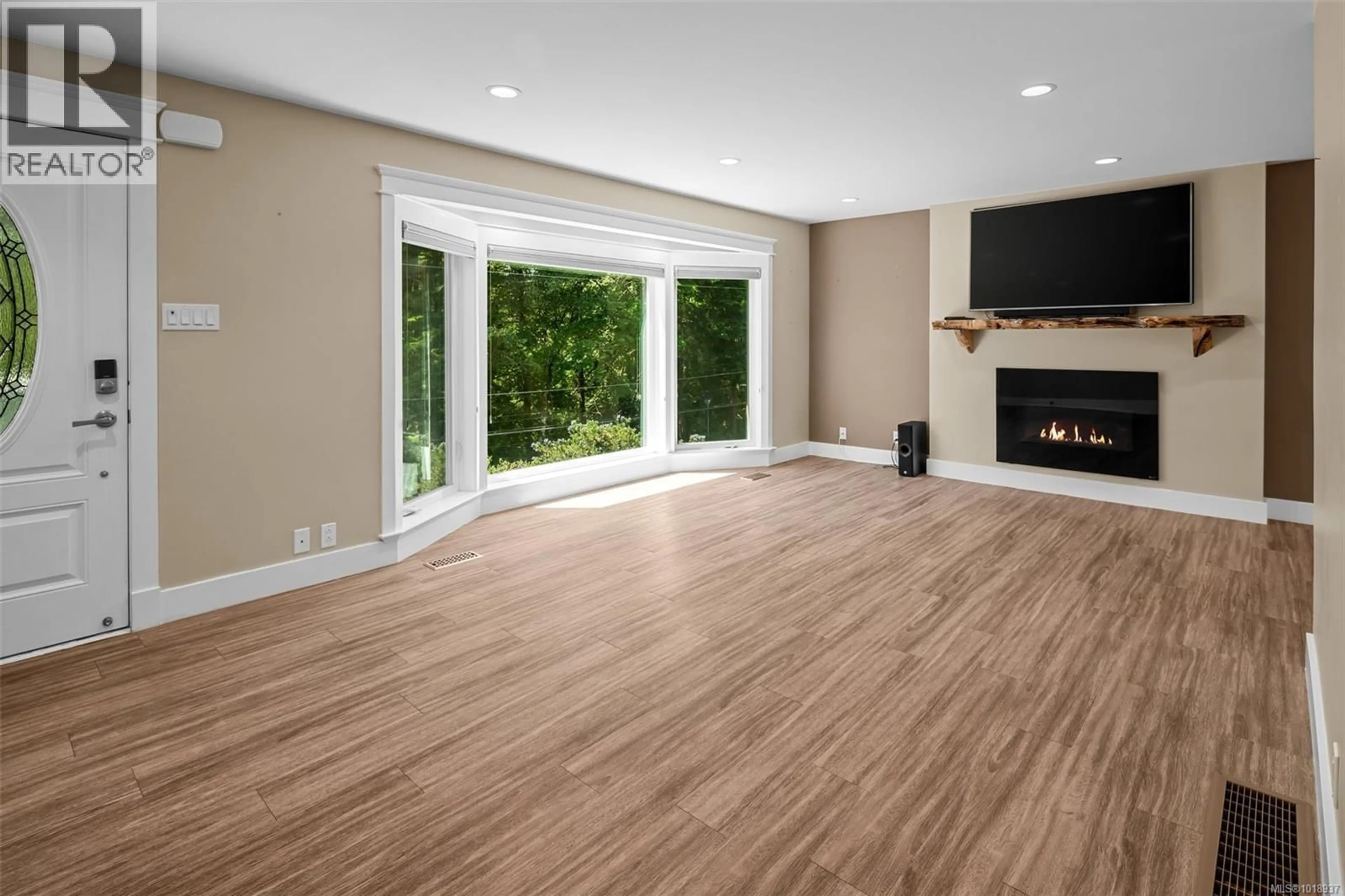 Living room with furniture, wood/laminate floor for 2381 BELLAMY ROAD, Langford British Columbia V9B3M8