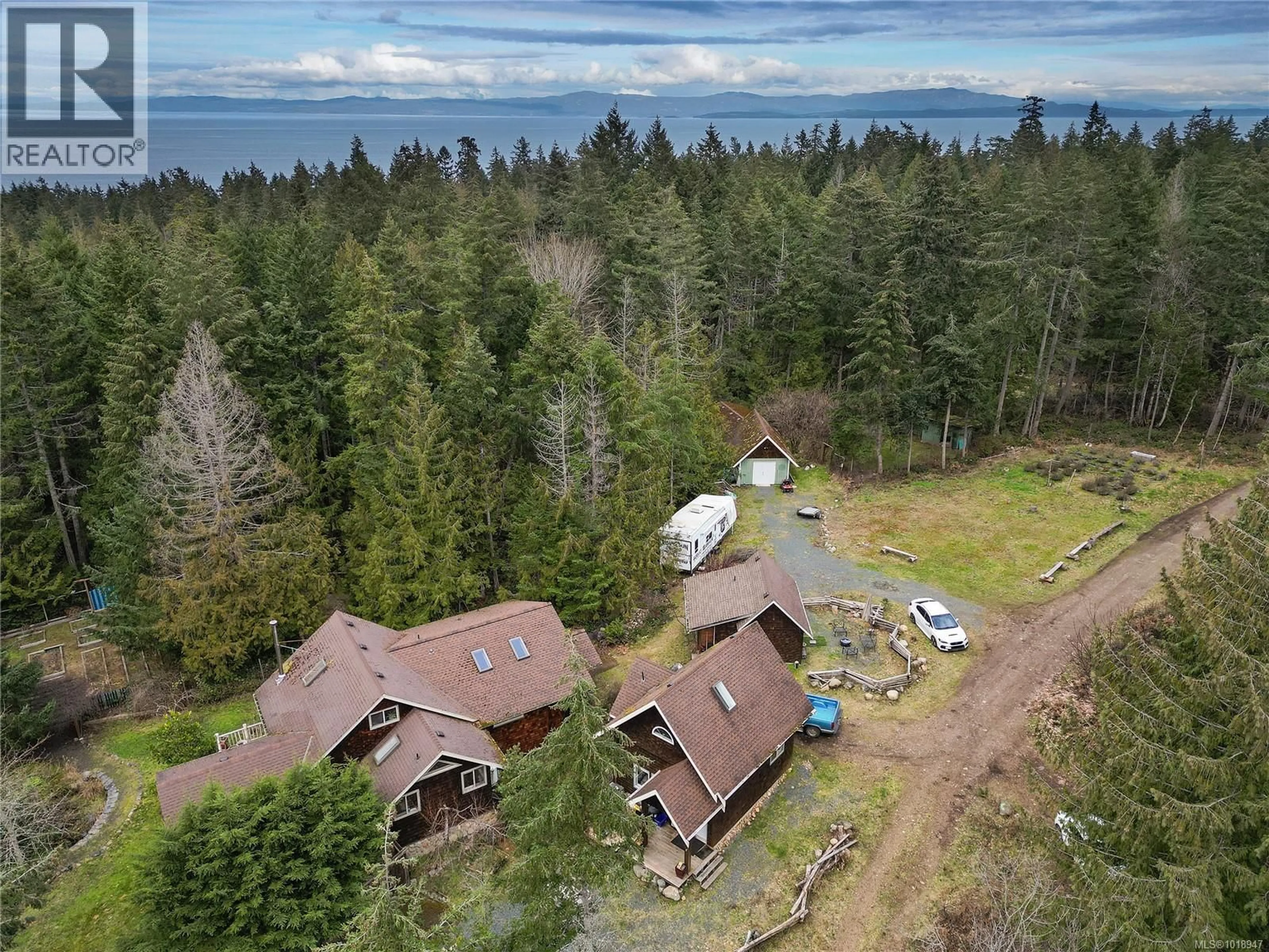 A pic from outside/outdoor area/front of a property/back of a property/a pic from drone, forest/trees view for 300 BONSAI PLACE, Qualicum Beach British Columbia V9K2A6