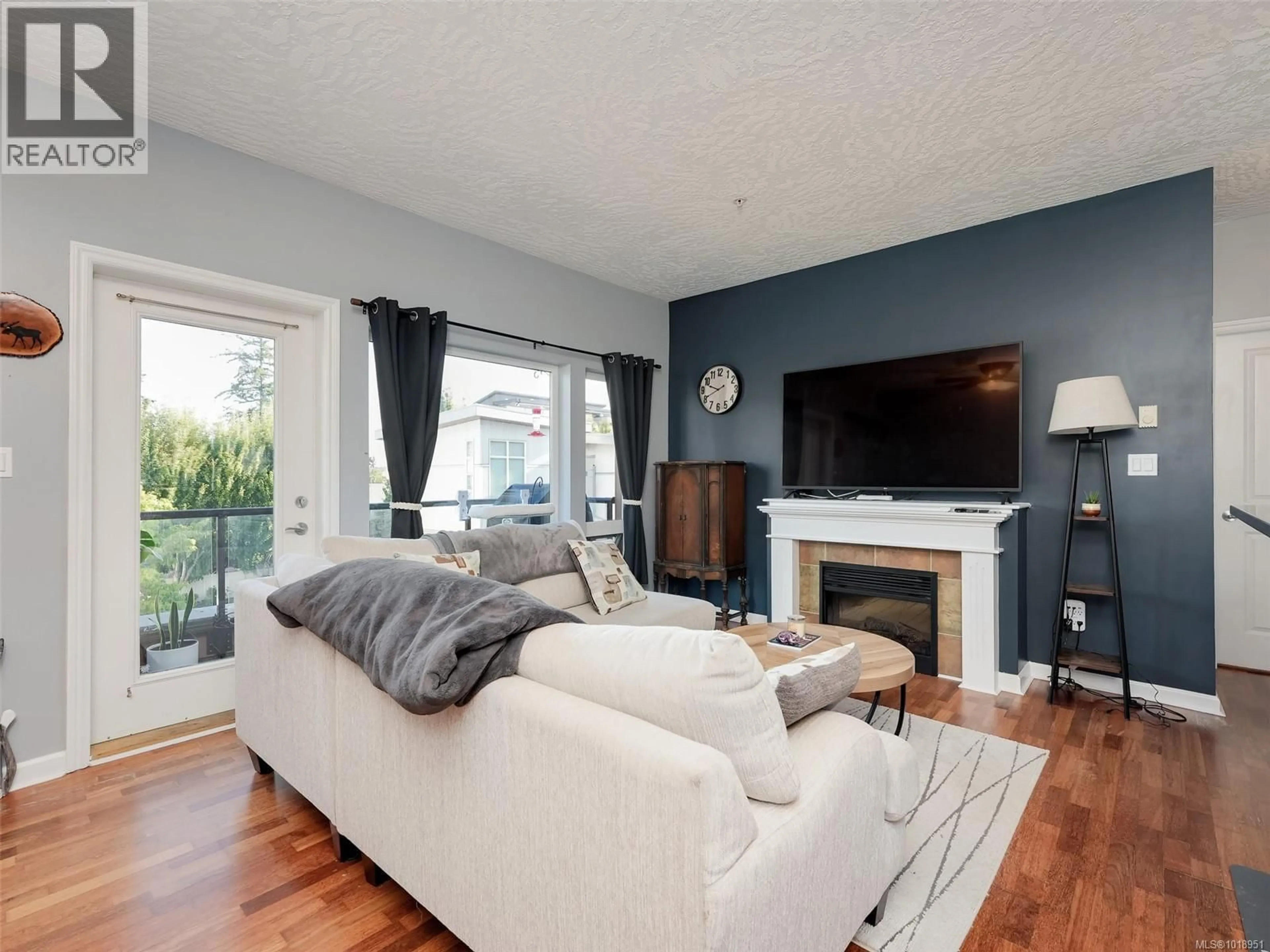 Living room with furniture, wood/laminate floor for 308 - 2747 JACKLIN ROAD, Langford British Columbia V9B3X7