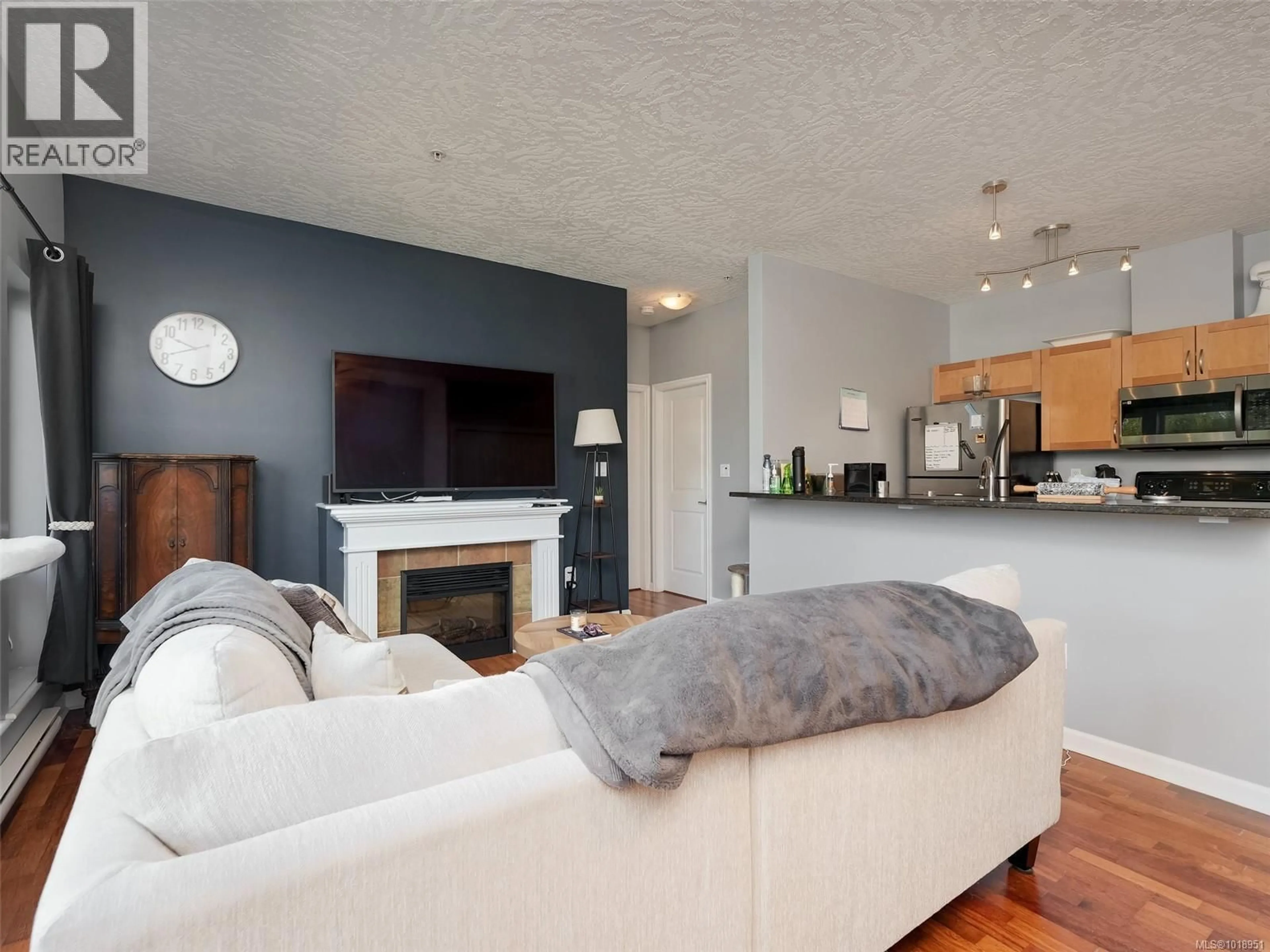 Living room with furniture, wood/laminate floor for 308 - 2747 JACKLIN ROAD, Langford British Columbia V9B3X7