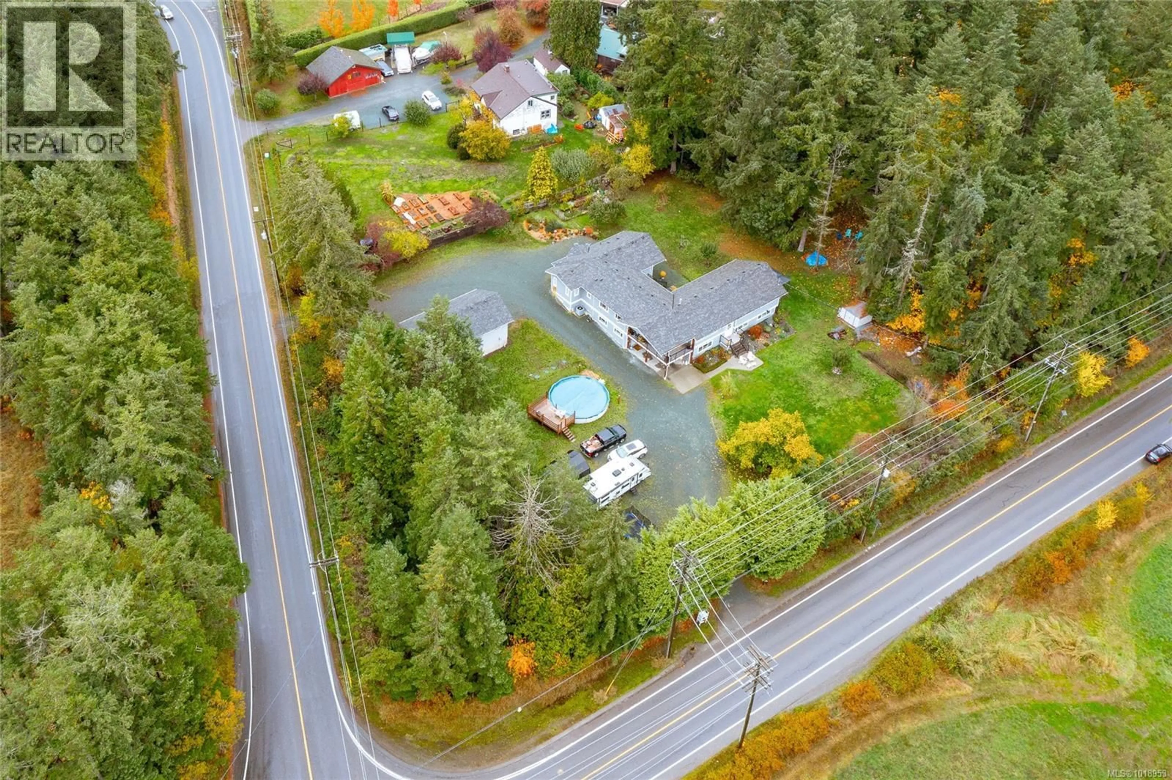 A pic from outside/outdoor area/front of a property/back of a property/a pic from drone, street for 1597 HERD ROAD, Duncan British Columbia V9L5W6
