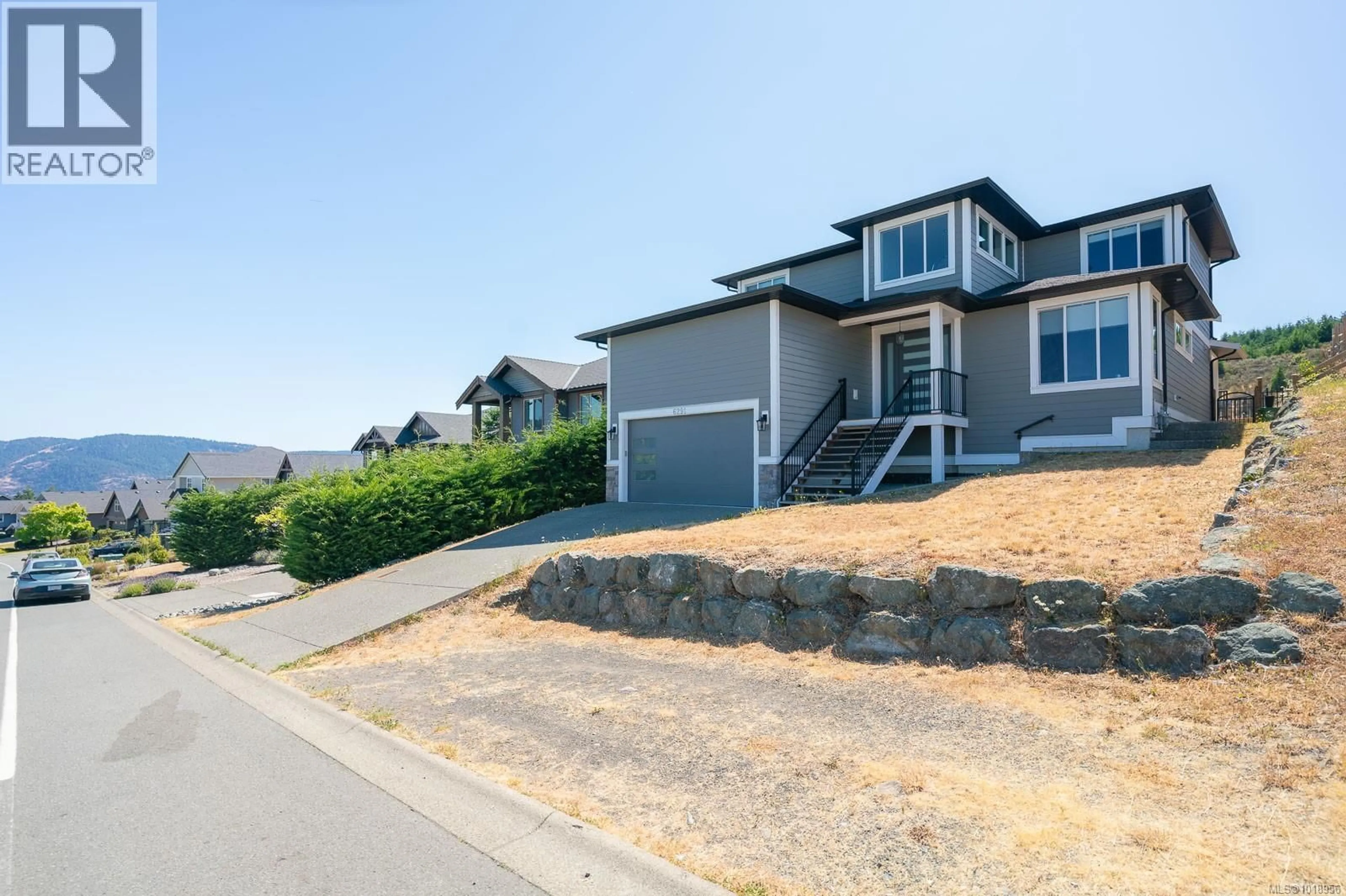 A pic from outside/outdoor area/front of a property/back of a property/a pic from drone, mountain view for 6291 NEVILANE DRIVE, Duncan British Columbia V9L0G1