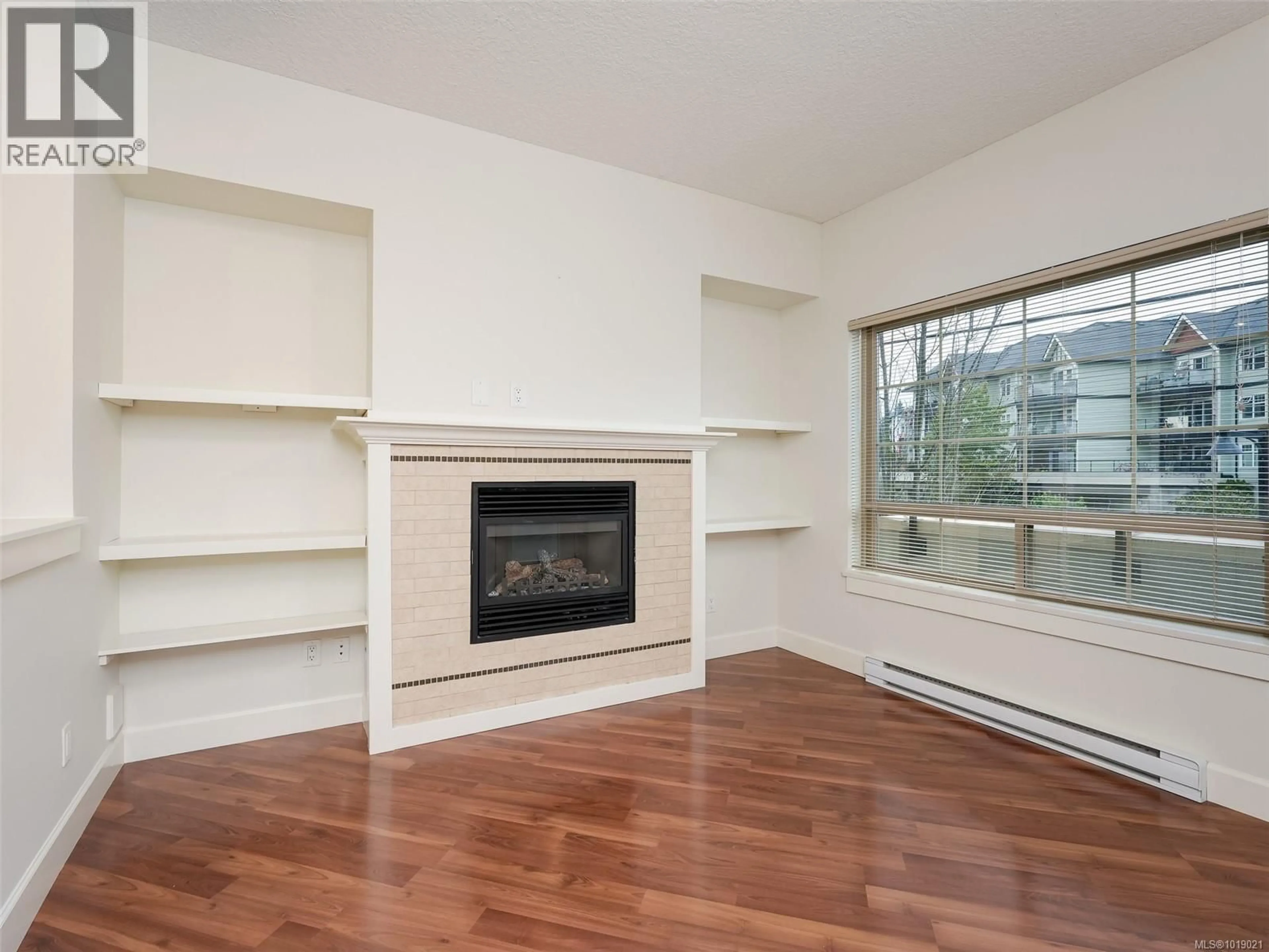 Living room with furniture, wood/laminate floor for 201 - 785 STATION AVENUE, Langford British Columbia V9B0E6
