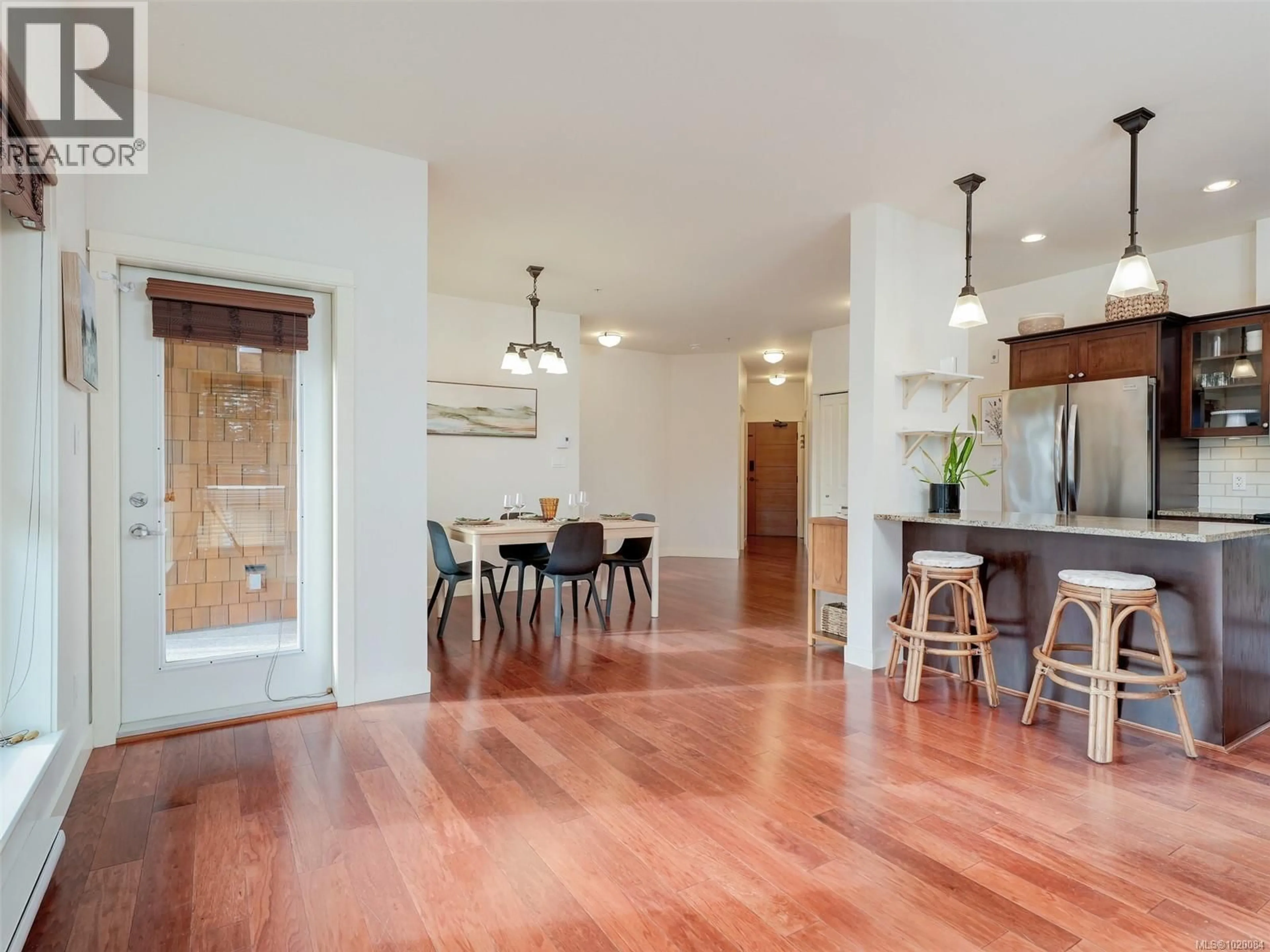 Open concept kitchen, wood/laminate floor for 407 - 201 NURSERY HILL DRIVE, View Royal British Columbia V9B0H7