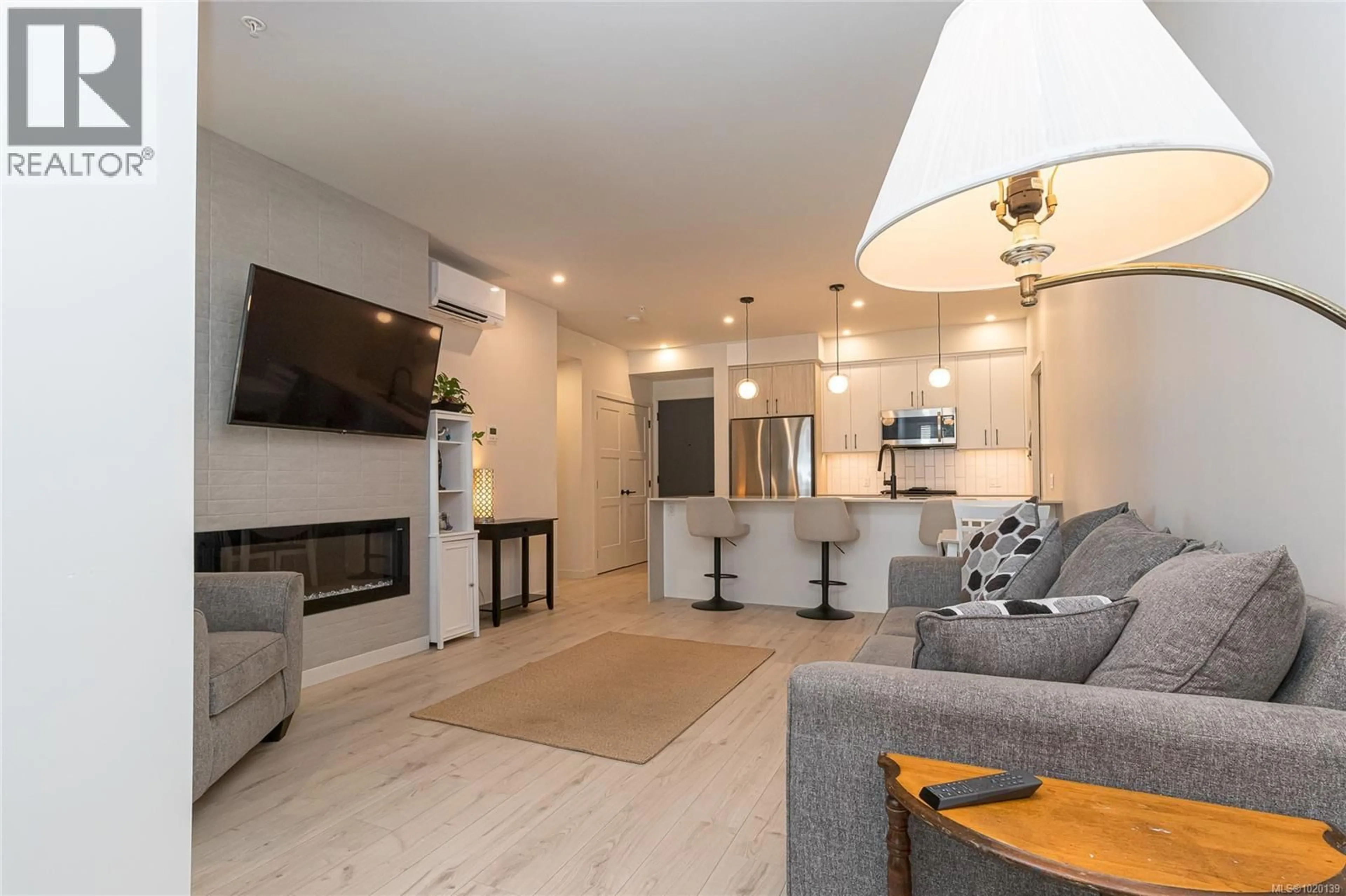 Living room with furniture, wood/laminate floor for 208 - 958 PHAROAH MEWS, Langford British Columbia V9B6W6