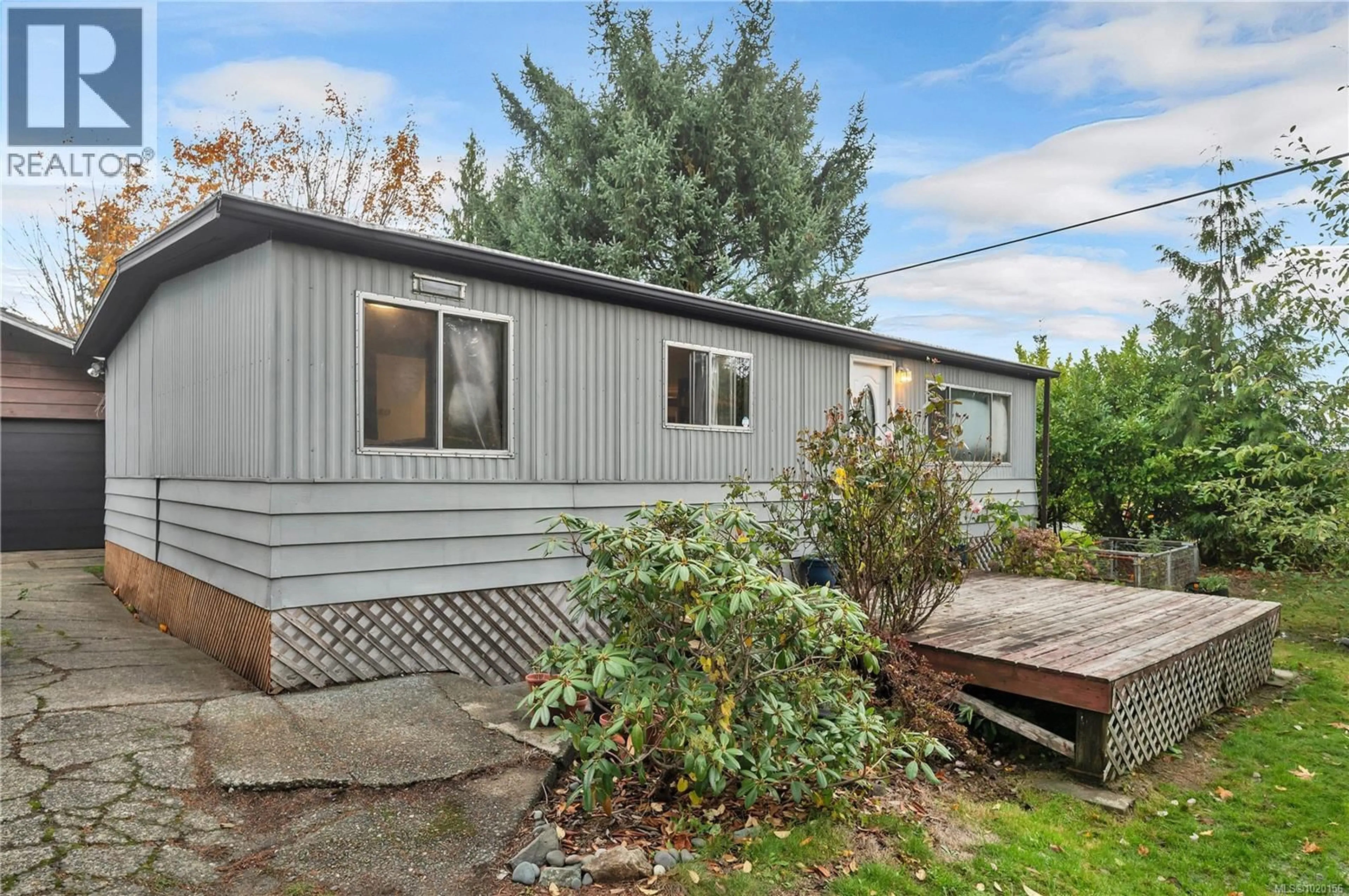 Home with vinyl exterior material, street for 1760 MCDONALD ROAD, Campbell River British Columbia V9W5K1