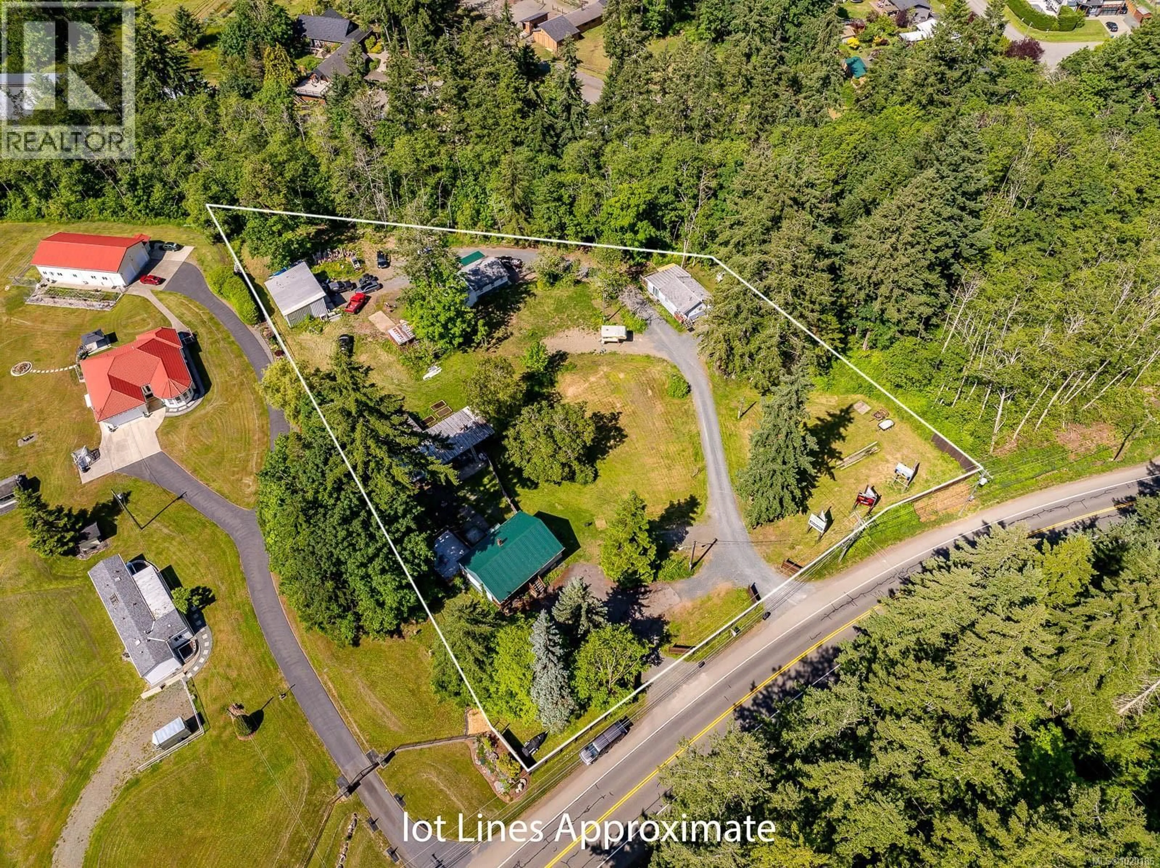 A pic from outside/outdoor area/front of a property/back of a property/a pic from drone, street for 4399 ISLAND HIGHWAY SOUTH, Courtenay British Columbia V9N9T1