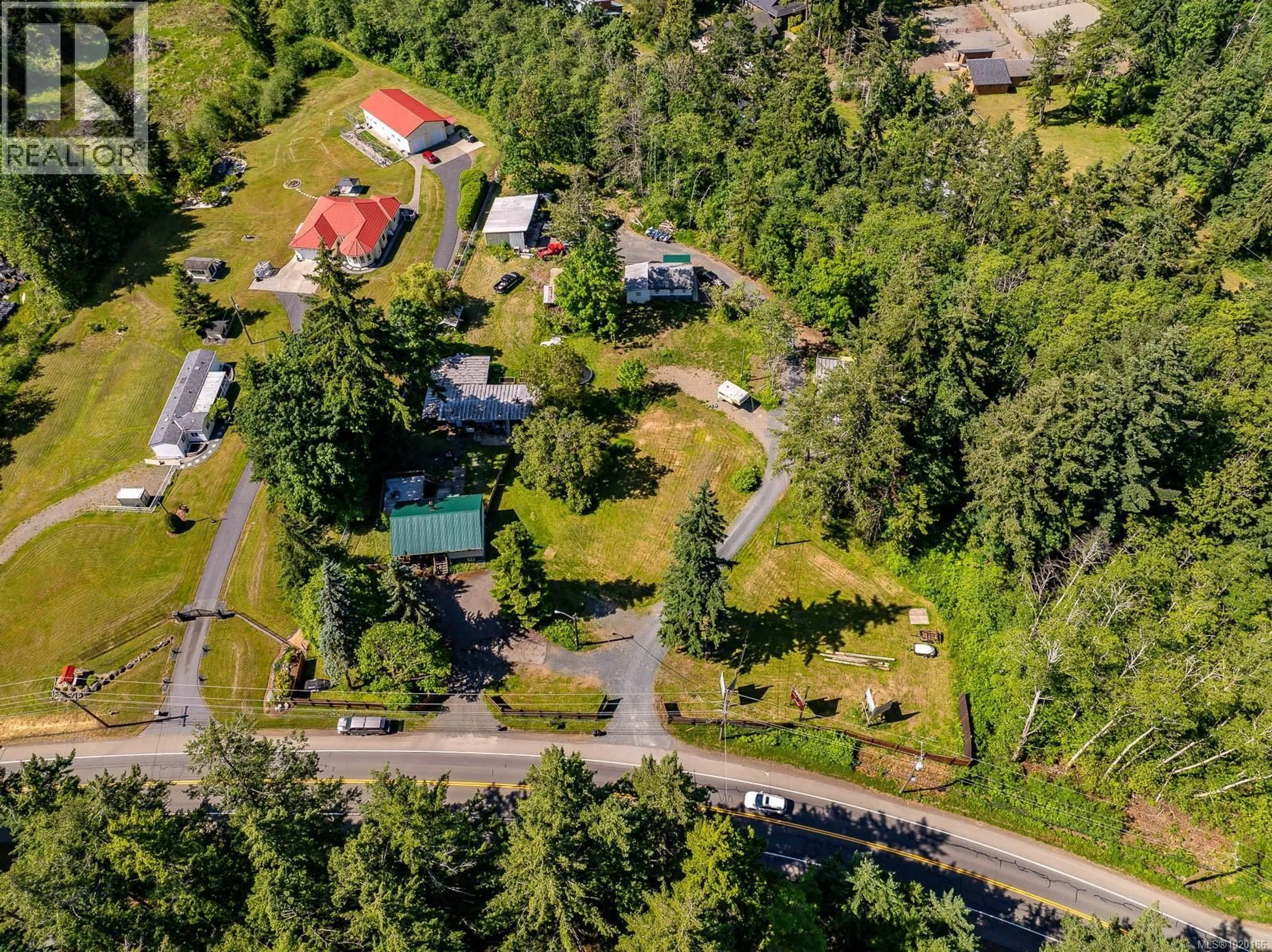 A pic from outside/outdoor area/front of a property/back of a property/a pic from drone, street for 4399 ISLAND HIGHWAY SOUTH, Courtenay British Columbia V9N9T1
