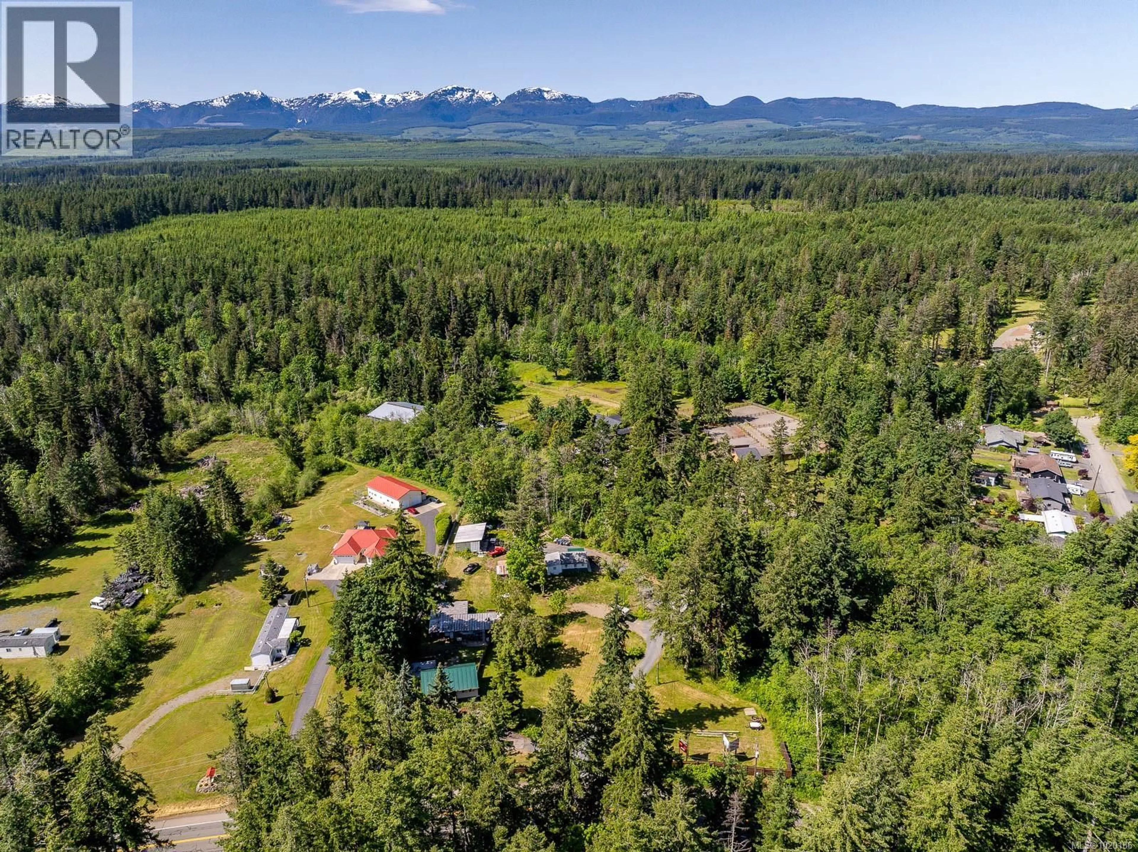 A pic from outside/outdoor area/front of a property/back of a property/a pic from drone, mountain view for 4399 ISLAND HIGHWAY SOUTH, Courtenay British Columbia V9N9T1
